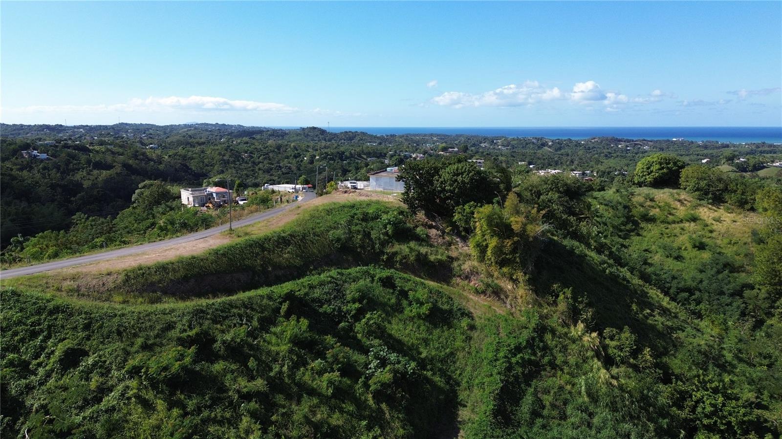 Amazing Land combining Nature and ocean view from the mountain. Build thr house of yourd dreams in this lot surrounded by nature in a tranquil area. Only 7 minutes away from the center of Aguada town and 15 minutes away from Rincon Town. Is close to school, supermarket, hardware and pharmacy.