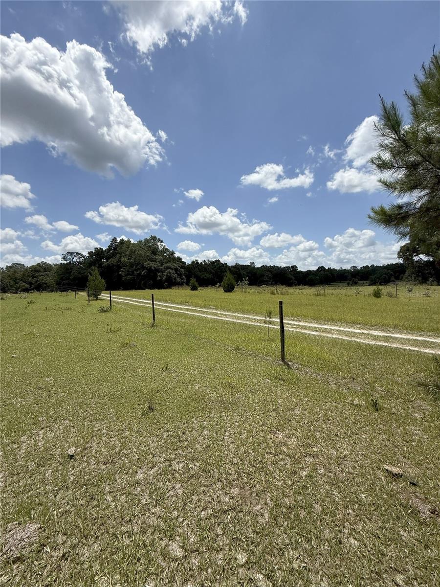 20 acres of A-1 zoned land in Fort White, Columbia County—ideal for agriculture, livestock, or building a private homestead. Features include road frontage on SW Barwick Terrace (unpaved) and nearby electric service available for connection (verify with provider). No HOA restrictions. This property offers flexibility for farming, equestrian use, or rural living. Conveniently located just minutes from Fort White, Ichetucknee Springs, and the Santa Fe River. A great opportunity to own usable acreage in a growing area.
