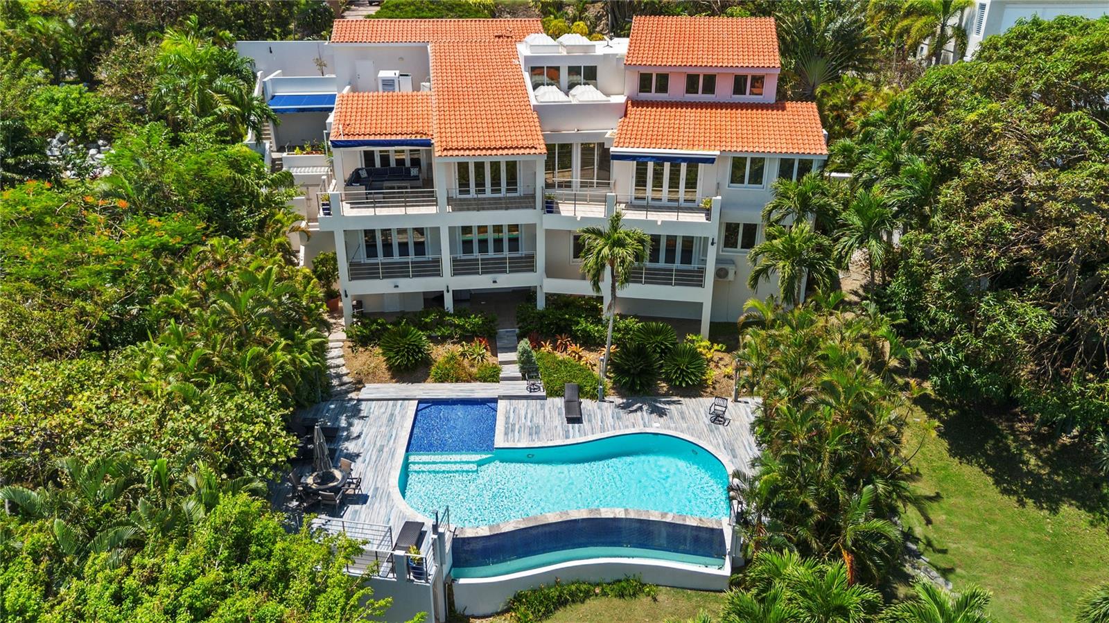 Welcome to Ridge Top 12, an exquisite 3-story estate nestled into the cliffside in the exclusive Palmas del Mar Community. Ocean Views from nearly every room. Remodeled in 2024. Tropical setting, lush landscaping & ample privacy create a personal oasis. Close to the beach, golf courses, marinas, restaurants & more. Infinity pool, terraces & decks for entertaining guests or relaxing in the natural beauty. Modern kitchen w/high-end appliances. Temperature-controlled wine cellar for storing & showcasing wine. 5 beds, 5 baths + 2powder rooms & 5,116 SF of living space on half an acre. Take in stunning views & enjoy natura light w/floor-to-ceiling windows. Primary suite boasts outdoor shower. Motorized hurricane shutters & 30K diesel generator create peace of mind.
Seller will consider Seller Financing. Seller accepts partial payment with CRYPTO currency. Property is under an LLC.
Palmas del Mar HOA: $1,300/year