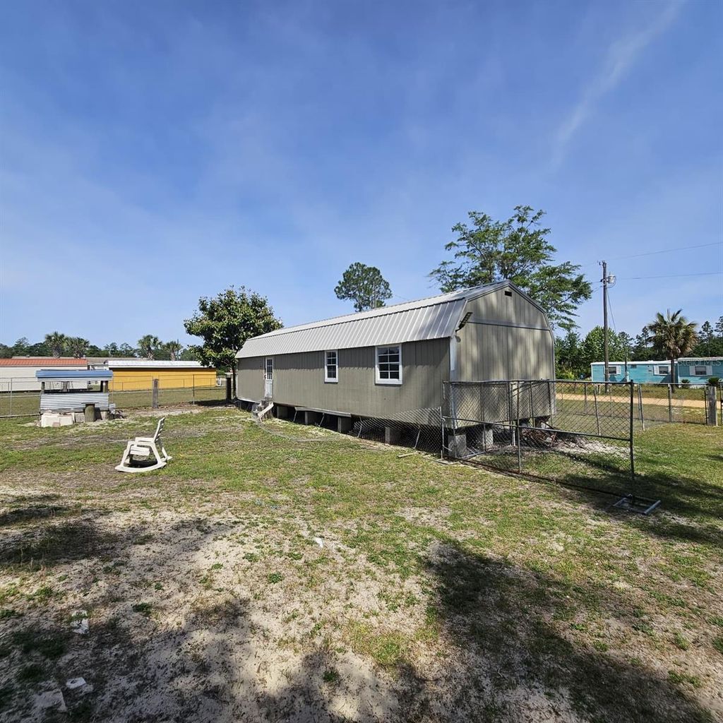 Photo of 12132 Pineridge Road, Fountain, FL 32438 (MLS # O6403857)
