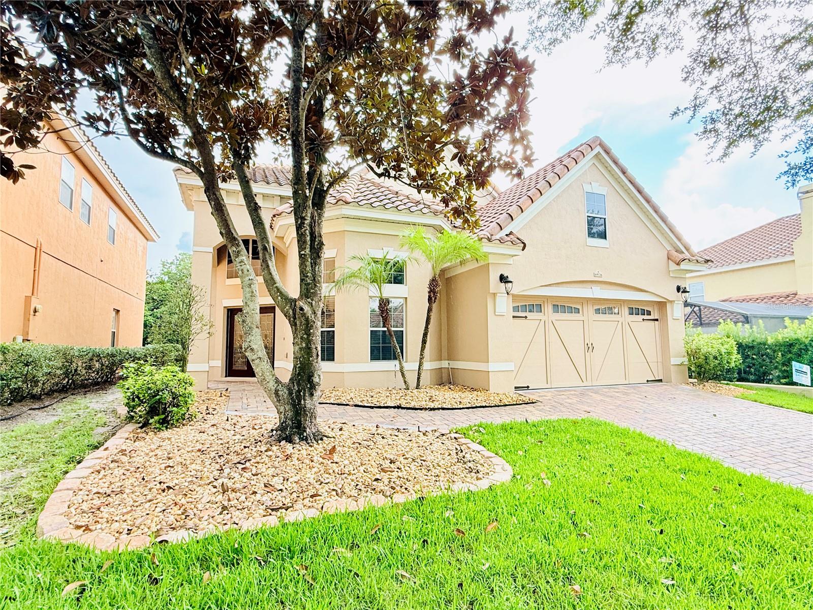 Welcome to this beautifully maintained and freshly painted residence in the highly sought after 24/7 virtual guard gated community of Toscana. Ideally located just minutes from Universal Studios and surrounded by tree-lined canopy streets, this home offers the perfect blend of sophistication, comfort, and convenience in one of Orlando’s most sought-after neighborhoods.
Offering a total of 3,353 gross square feet, with 2,960 square feet of refined living space, this home features four bedrooms and two and a half baths, including a spacious master suite on the ground floor. Inside, you’ll find luxury vinyl flooring throughout the main living areas and bedrooms, complemented by timeless tile in select spaces. The living room is enhanced by rich textures and expansive windows that flood the interior with natural light. The open-concept kitchen is designed for both everyday living and effortless entertaining, while a conveniently located half bath completes the main level.
Upstairs, three generously sized bedrooms are accompanied by a versatile office or den and a full bathroom, creating a well-balanced layout of private and shared spaces.
Step outside to your own private retreat, complete with a newly resurfaced pool and brand-new pump. The fully screened enclosure and expansive deck provide the perfect backdrop for year-round relaxation and gatherings.
Every detail reflects lasting quality, from the elegant tile roof to the grand front door and carefully curated finishes throughout. Toscana itself elevates daily living with the security of 24/7 virtual guard gated access, excellent schools, and unmatched convenience to premier dining, shopping, supermarkets, pharmacies, and places of worship for a variety of faiths. For travelers, Orlando International Airport is only 15 miles away, making connections effortless.
This is more than a home. It is a lifestyle defined by comfort, community, location and timeless elegance.