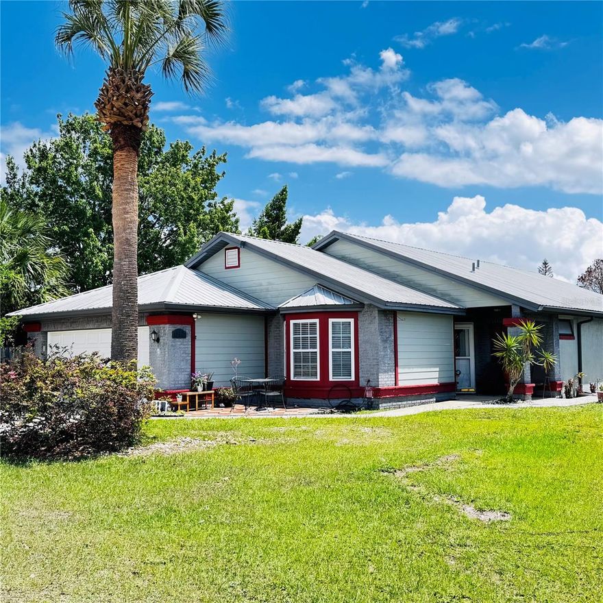 This well-maintained 4-bedroom, 2-bath residence with a Florida Room and a 2-car garage offers a perfect blend of comfort, functionality, and location. Featuring beautiful hardwood and tile flooring throughout, along with crown molding.

The kitchen is equipped with solid oak cabinetry, Corian counter tops and includes essential appliances such as stove, refrigerator, and microwave, making it move-in ready. Ceiling fans in every room are also included.

A major upgrade includes a 2004 metal roof with a 40-year warranty, providing long-term peace of mind. The home also features a double driveway, offering ample parking space for boat or RV, along with a 2-car garage with plenty of storage cabinets for optimal organization.

Enjoy outdoor living with a fully fenced back patio, perfect for privacy, pets, or entertaining. The enclosed Florida room expands your living space, ideal for relaxing or hosting guests. Additionally, a large shed provides excellent space for tools, seasonal items, or hobbies.

This property offers a spacious living room and gathering areas—perfect for hosting family and friends.

Additional highlights include:
Prime location: 13 minutes from Orlando International Airport (OIA), 17 minutes from Disney, easy access to major highways, restaurants, grocery stores, and medical centers.