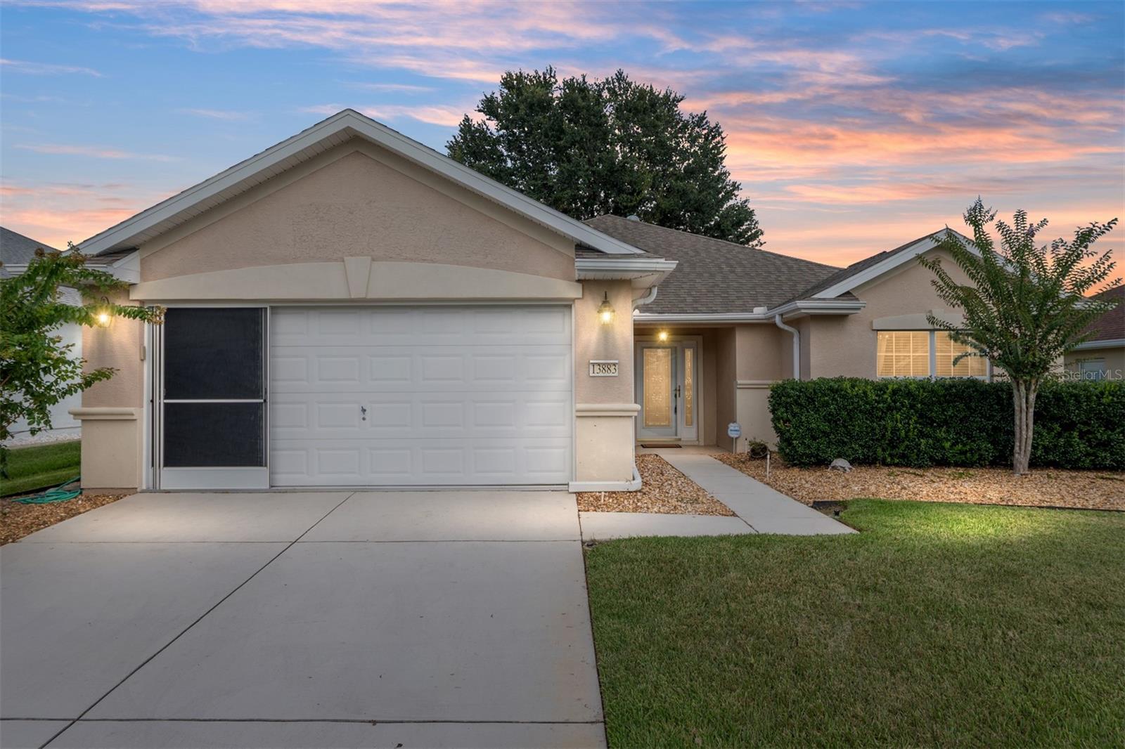 This popular Citation model is located in WINDWARD HILLS. A Concrete/Block and stucco home offers two bedrooms, two baths, and a versatile DEN, with 1,575 square feet of living space. NEW ROOF To be installed AUGUST 11-15th, HVAC 2021, Beautiful wood floors, Eat-In Kitchen, Crown Molding, Primary bath has UPGRADED CUSTOM SHOWER, Higher Vanities, newer appliances. The 29'x10' Enclosed Lanai has a stunning paver floor. AWARD-WINNING Del Webb Spruce Creek Golf & Country Club is a GATED, 3,250 home, +55 Community with over 70 clubs, 3 pools, a Clubhouse, a Fitness Center, Bocce Ball, Shuffleboard, 12 Pickle ball Courts, 7 Tennis Courts, Sand Volleyball, Water Volleyball, Lake Vista Gazebo, Pavilions, Walking Paths and so much more! Come see this beautiful community with a GORGEOUS Tree Canopy on the Boulevard and its own Restaurant, Liberty Grille. Come, enjoy the four (4) 9-hole Golf Courses today and begin living your BEST LIFE! COME SEE FOR YOURSELF!
