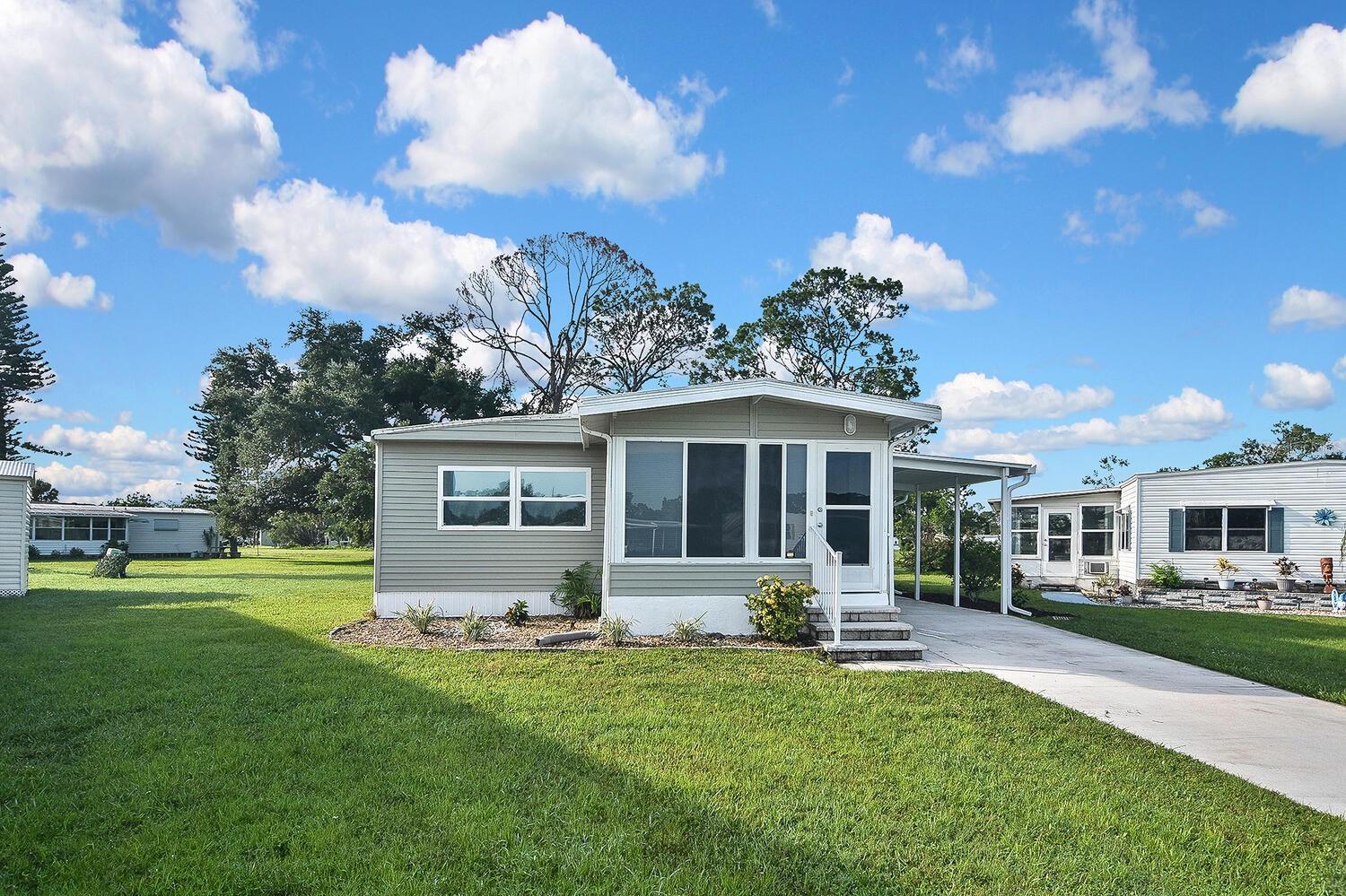 Turn-key double-wide home in Holiday Park! Completely renovated and gutted to the studs with a bonus Florida room, located in the pet section of Holiday Park — a gated 55+ community where you own the land.
INTERIOR FEATURES:
• Full renovation with new insulation, floors, drywall, plumbing, and electrical
• New carport and screened lanai
• 1,247 sq ft with 3 bedrooms, 2 bathrooms, plus lanai and Florida room
• Bright, open living area
• Updated kitchen with granite countertops, soft-close cabinets, and new appliances
• Primary suite with en-suite bath
• Stackable LG washer and dryer
• Bonus Florida room for extra living space
• Exterior shed for tools, bikes, or beach gear
• Sold turn-key furnished for a seamless move-in
ABOUT HOLIDAY PARK:
Holiday Park has no monthly HOA — instead, lawn care, community services, and all amenities are included in your annual property taxes as part of the special district. Located in Flood Zone X (no flood insurance required).
COMMUNITY AMENITIES:
• Two heated swimming pools
• Tennis, pickleball, bocce, shuffleboard, and horseshoes
• Billiards room, library, line dancing, wood carving, bowling groups, and more
LOCATION & LIFESTYLE:
Holiday Park offers unbeatable value and a welcoming, active Florida lifestyle. Whether you’re looking for a winter escape or a full-time residence, this home checks all the boxes. Schedule your showing today!