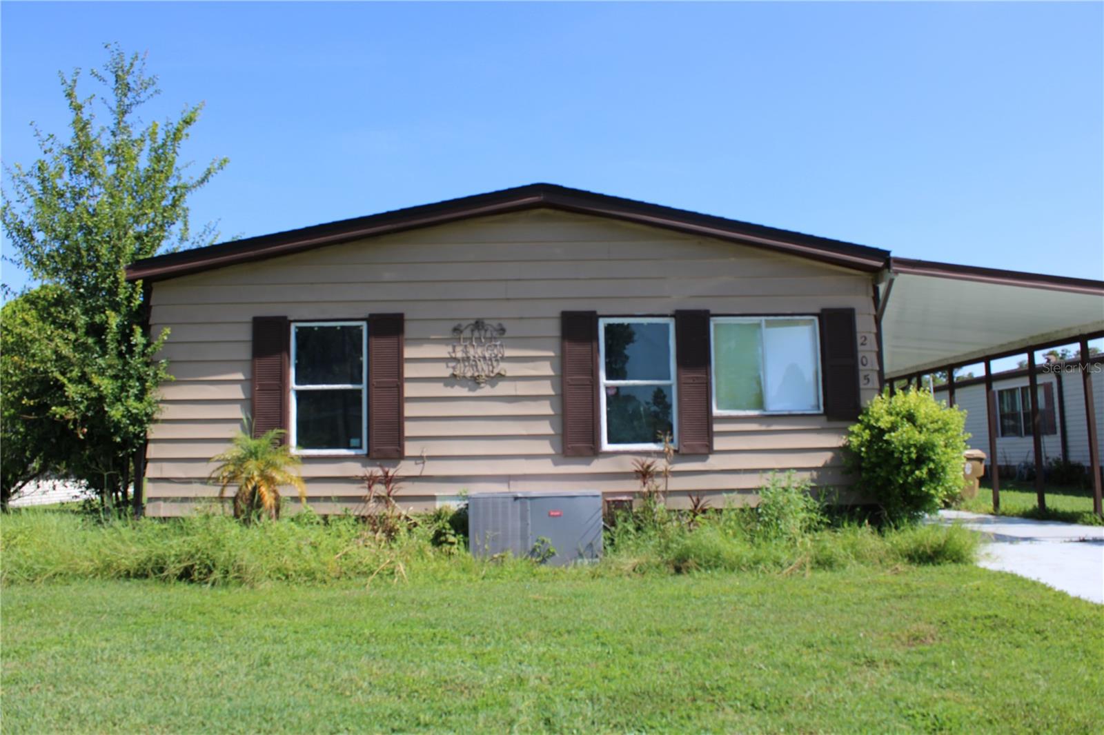 3 Bedroom, 2 Bath Double-Wide Manufactured Home – NO Lot Rent! Located in the desirable Broadmoor community in Kissimmee, Osceola County, this spacious 3-bedroom, 2-bath double-wide manufactured home offers comfortable living with NO lot rent! The kitchen features granite countertops and stainless steel cabinets, and flows nicely into a combined family room and dinette area—perfect for everyday living and entertaining. Laminate flooring runs throughout the home, adding a clean and modern touch. A laundry room is conveniently located next to the kitchen. The master bedroom is generously sized, and the master bathroom includes dual granite vanities, a garden tub, and a separate shower. Enjoy the outdoors in the covered, enclosed patio porch overlooking a peaceful pond view. Additional features include a carport with a storage area behind it for added convenience. Community amenities include a swimming pool, clubhouse, and playground—all designed to enhance your lifestyle. Don’t miss this opportunity to own a great home in one of Osceola County’s well-maintained communities! . ****Home square footage, taxes, lot sizes, and schools; MH width and straps under manufactured home and septic are to be independently verified.***