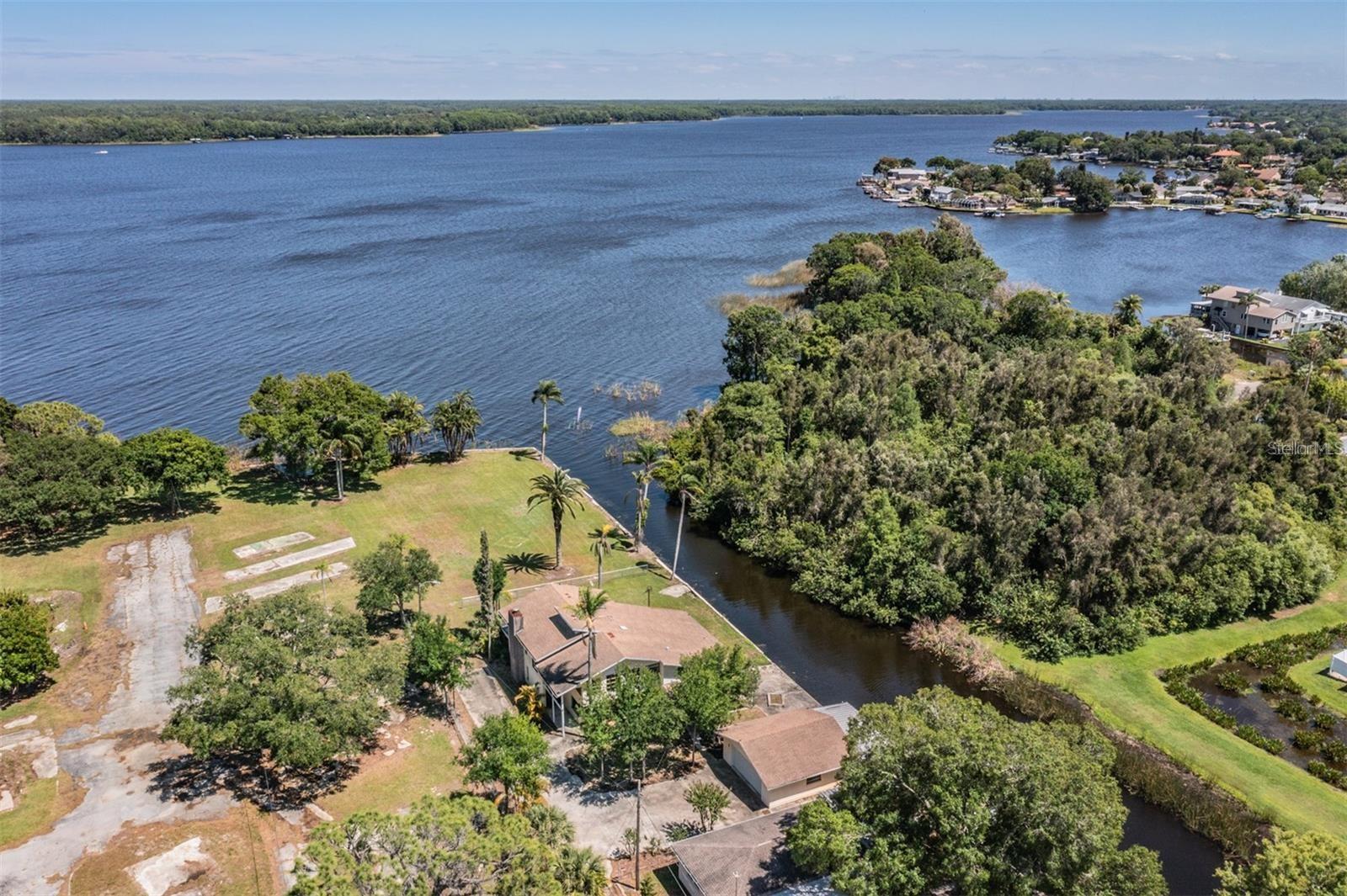 Extremely rare waterfront fixer-upper gem in one of the most desirable and rapidly appreciating corners of Lake Tarpon. The seller’s surprise relocation gives you the rare chance to snatch up this 4 bed, 3 bath luxury two-floor home on a lushly landscaped .42-acre lot with 150 feet of seawalled water frontage at the lowest price per sq ft in the area. Gutted down to the studs and ready for your vision, this home offers excellent opportunity for investors and savvy owner-occupants alike. So what makes this one so special? 1) Direct canal access to Lake Tarpon, with 150 ft of water frontage and seawall already in place. 2) Oversized .42-acre lot, with plenty of room for toys and boats, hosting, and potential future enhancements. 3) Massive 2-car garage providing ample extra storage space. 4) Huge back patio area with sliding glass doors, inviting you to unwind and savor peaceful evenings surrounded by nature. 5) 4 bedrooms and 3 bathrooms including a spacious upstairs master suite with walk-in closet and private bath. 6) Expansive family room with open-concept layout downstairs. 7) Large modern windows throughout providing an abundance of natural light and beautiful views. 8) Lush natural landscaping with mature palms and flowering trees in a serene tropical setting. 9) Prime location near schools, parks, restaurants, shopping, golf courses, and Tampa International Airport. Whether you're looking for your next flip, a long-term hold, or the perfect opportunity to design your dream waterfront home, this property offers unbeatable value and lifestyle potential in Palm Harbor. Easy to show. No HOA/CDD. Feel free to soft pitch before writing anything up. Ask me anything, big or small. If this is “NOT ON MY MLS,” disclosures and MLS info sheets are available. No assignable contracts accepted.