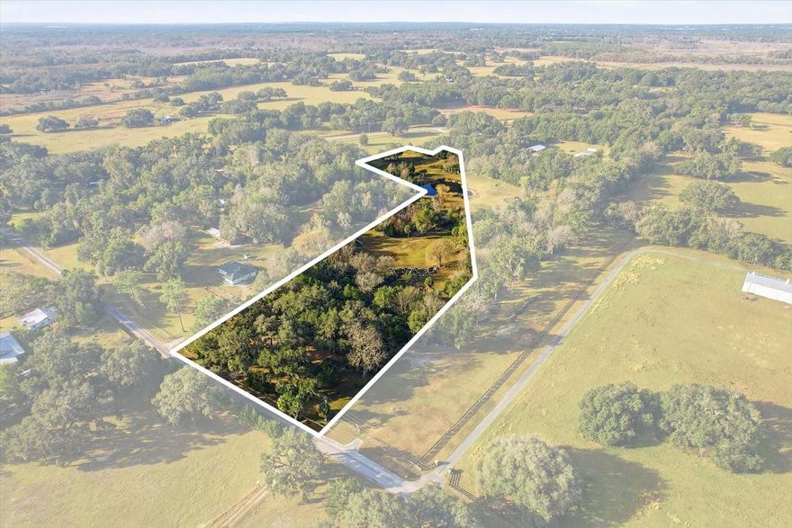 A True Naturescape Legacy: Discover This One-of-a-Kind West Central Florida Paradise. Welcome to a property that is more than just land; it is a meticulously sculpted, 25-year labor of love and a pristine environmental sanctuary. This rare offering presents the unique opportunity to own a world-away retreat that is secluded, yet incredibly accessible—less than 10 minutes to Bushnell and 20 minutes to Inverness. Feel the natural, restorative earth vibe that permeates this high and dry parcel, a proven high-ground location with a massive natural water retention area (DRA) ensuring security and peace of mind. The owner has worked in close consultation with the Florida Department of Environmental Protection, successfully completing an environmental reclamation project that has fostered a flourishing ecosystem of native fauna and flora. Imagine stepping into your own private naturescape, where crystal-clear aquifer-fed water features and established majestic native tree species thrive. The current meticulous maintenance includes a focus on natural health, avoiding fertilizers and pesticides to preserve the delicate balance. This is a quiet, low-density road, revered by residents for its deep sense of community, security, and the small-town Americana atmosphere; development is naturally restricted by protective zoning. This offering is particularly unique as it can be purchased in conjunction with the adjacent parcel, granting a buyer maximum acreage, privacy, and limitless potential. If you are searching for possibly the most beautiful and singular property in the region, ready for the construction of your custom dream home, look no further. This is a must-see for the discerning buyer who values privacy, natural beauty, and a truly unique investment. Do not delay—contact your agent today to schedule a private showing and experience the pride of this ownership opportunity firsthand.