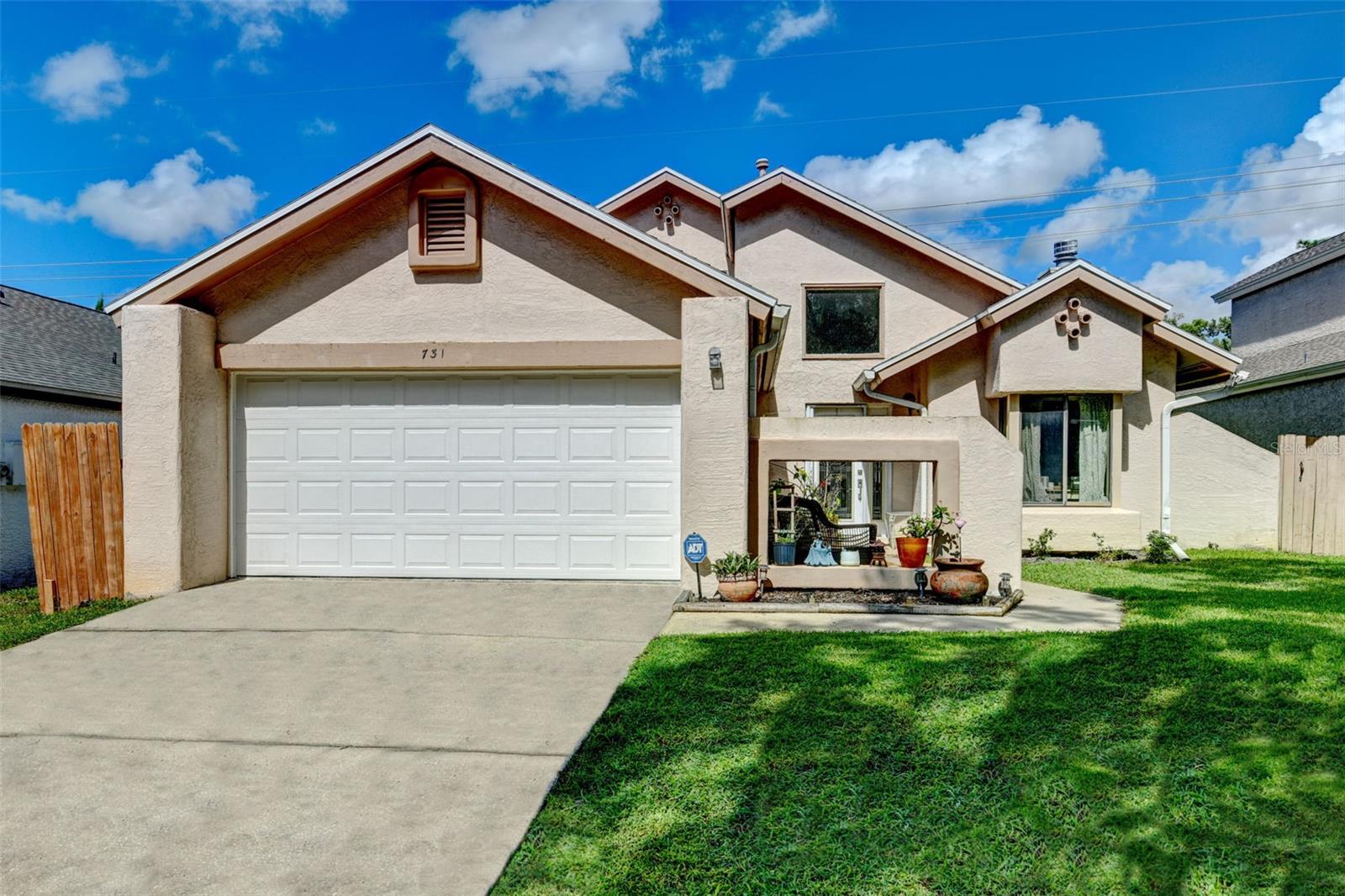 Welcome to 731 Crestbrook Loop in The Landings- one of Longwood’s most desirable gated communities! Tucked away among mature trees and winding streets, this sought-after neighborhood offers privacy, a tranquil setting, and a lifestyle you’ll love. Enjoy exclusive access to two tennis courts and a beautiful, resort-style community pool area perfect for relaxing weekends or active afternoons. Plus, you’re in a top-rated Seminole County school district and just minutes from popular dining, shopping, and entertainment.
This move-in ready home has been thoughtfully updated. A new roof and skylights (2021) provide peace of mind, while new laminate flooring (2023) enhances the main level’s style and durability. The kitchen remodel (2017) created a bright, functional, and beautiful space with rich wood cabinetry, granite countertops, stainless steel appliances, and a charming greenhouse window that floods the room with sunlight. The dining area opens directly to the backyard for seamless indoor-outdoor entertaining.
From the moment you step inside, this home impresses with its soaring vaulted ceilings, dramatic natural light from windows, doors, and skylights, and an inviting open layout. The spacious living room features a stunning wood-burning fireplace with a new chimney cap and a striking stacked stone surround – the perfect centerpiece for cozy evenings. Elegant rod iron railings with warm wood trim frame the staircase, adding architectural character.
The oversized primary suite is a true retreat, complete with sliding doors to the backyard, a generous layout, and a gorgeous ensuite bath and custom closet remodel (2020). The bathroom features dual sinks, a marble-look vanity, updated lighting, and a luxurious walk-in shower with decorative tile inlay. The custom walk-in closet offers abundant storage with built-in shelving, drawers, and organization for everything.
Upstairs, you’ll find two additional oversized bedrooms, a well-appointed full bath. The office is located on the first floor, right off the foyer– ideal for working from home or creating a hobby or playroom.
The fenced backyard offers peaceful pond views with no rear neighbors, providing a private and relaxing outdoor escape. Whether dining al fresco on the patio or enjoying the quiet breeze from the pond behind the house, this space is perfect for unwinding.
If you’re looking for affordable luxury in a prime Central Florida location, 731 Crestbrook Loop offers the best of top rated schools, community amenities, updated style, and spacious living – all in one exceptional home. Make your appointment to see it today!!!