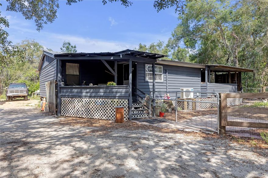 Charming 3BR/2BA Mobile Home on Double Lot in Dade City – MOTIVATED SELLER! NO HOA, NO CDD. 

Welcome to 4748 Merlin Circle – 3-bedroom, 2-bathroom home nestled in the peaceful Camelot community, directly across from the Withlacoochee River. Enjoy country living at its finest with 960 sq ft of thoughtfully designed space featuring a split floorplan, open layout, and an updated kitchen with ample cabinetry.

The master suite offers a large shower and a SafeStep jetted tub, perfect for unwinding. Additional upgrades include:
26-gauge metal roof
Brand new water heater
200 Amp electric panel & upgraded service line
Whole house sediment filter & reverse osmosis system
New Cypress siding (within 5 years)

Situated on a double lot, the property also includes a 17x22 powered carport/workshop, a 10x16 enclosed shed, an enclosed rear porch, and two open front porches—ideal for relaxing or entertaining. With no HOA, there's room for all your toys, and the quiet location at the end of the road provides extra privacy.

Minutes to downtown Dade City’s shops, restaurants, and parks—don’t miss this opportunity to own a slice of Florida’s scenic countryside.