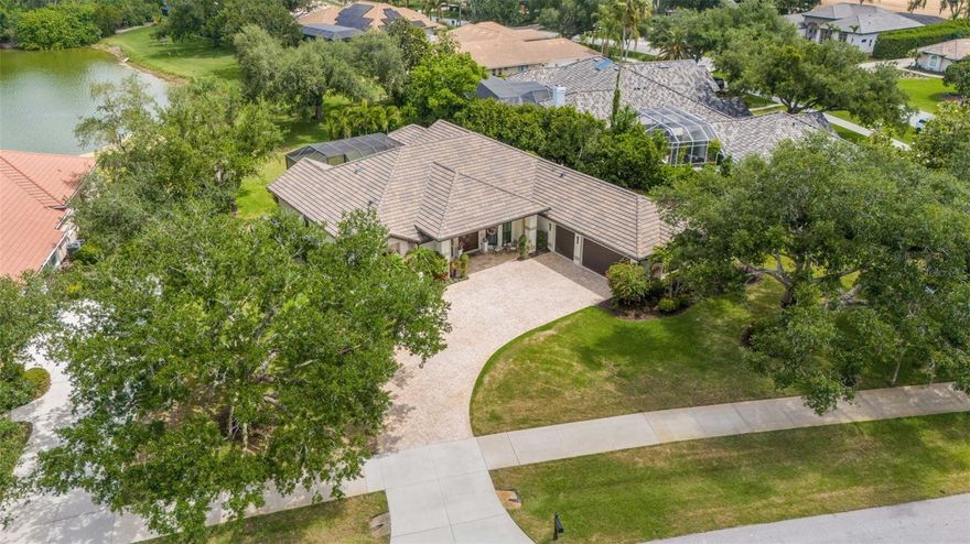 Don’t miss this unique opportunity to own an "outstanding" 4-bedroom, 3.5-bath residence located within the gates of Laurel Oak. This home is ideally positioned on a ½ acre plus premium lake lot with exceptional "natural" privacy, serene water and preserve views from your picture framed lanai.  Every home has a story, and this one began in 2020 when it was taken down to the studs and thoughtfully reimagined through a custom renovation—blending timeless design with modern functionality, and delivering a move-in ready experience with lasting peace of mind.  The architectural details include crown molding, tray and volume ceilings that highlight the sense of openness and elegance throughout the living spaces. The kitchen has been meticulously designed with expansive counter space and custom cabinetry, creating a natural balance between everyday comfort and functionality. It’s a space that supports daily living with ease while also accommodating those moments that call for gathering and celebration, it is open, practical, and tailored to the flow of everyday life. The transition from the interior living spaces to the exterior spaces creates a true indoor-outdoor lifestyle: inviting, open, and designed for everyday living. Multiple access points from room to room including the Primary & Secondary en-suites extend the living space outward, connecting naturally to the expansive under-cover lanai and pool area showcasing postcard-worthy views with peaceful sightlines. It’s a layout that offers flexibility.  Schedule your private showing today to experience this rare Laurel Oak Estates property. Residents have the option to join Laurel Oak Country Club, offering two 18-hole championship golf courses, 12 Har-Tru tennis courts, six pickleball courts, and an active social calendar. Ownership includes moving to the top of the waitlist and (next spot) priority placement on the country club waiting list. Beyond the gates, the location places you near shopping, dining, entertainment, medical facilities, major roadways, and Sarasota’s renowned beaches.