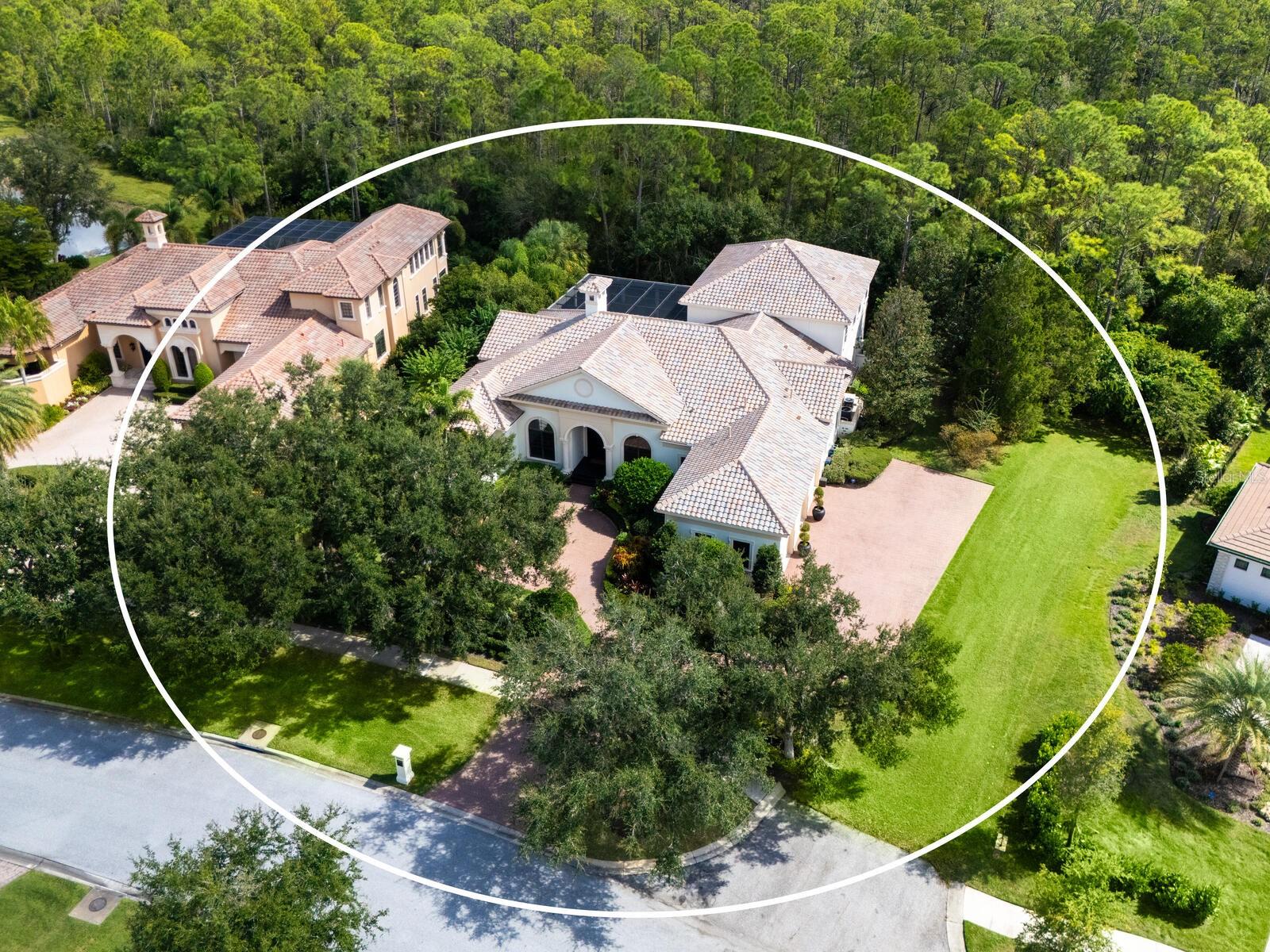 One or more photo(s) has been virtually staged. Located in The Concession, Southwest Florida’s most prestigious gated community, this John Cannon–built estate offers timeless craftsmanship, modern comfort, and the natural beauty of Oak Hammock Preserve. Encompassing 5,431 SF with four bedrooms, four-and-a-half baths, an office, and a three-car garage, it blends classic architecture with contemporary updates.  A pair of Cantera front doors opens to soaring ceilings, elegant millwork, and light-filled gathering spaces that flow effortlessly to the lush outdoors. The renovated kitchen combines style and function with custom cabinetry, quartz countertops, a designer backsplash, new GE Profile stainless-steel appliances, a butler’s pantry, and walk-in pantry - all opening to family room making entertaining a breeze. The primary suite offers bay-window seating, dual custom closets, and a redesigned bath with quartz-topped vanities, a standalone soaking tub, and an aquarium shower. Upstairs, a generous bonus and media area opens through disappearing sliders to a screened balcony overlooking the preserve. With a bedroom, full bath, and kitchenette, this level is perfect as a guest suite, in-law quarters, or private retreat. Outdoor living takes center stage with a heated saltwater pool and spa, fireplace, and new outdoor kitchen featuring a six-burner grill - an ideal sanctuary for lounging and refreshing. Lush new landscaping and lighting enhance the serene oak-lined setting, while a freshly sealed paver driveway leads to the three-car garage with 12-foot doors. Recent updates include new porcelain tile flooring, fresh interior and exterior paint, a brand-new barrel tile roof with warranty, three new air-conditioning units with five zones, whole-house water filtration, and updated irrigation system.  The wet bar, laundry room, and powder bath have also been modernized with new cabinetry, quartz surfaces, and designer finishes.  Set within the gates of The Concession, this exclusive enclave is celebrated for its grand estates, unspoiled natural preserves, and unmatched privacy. Residents may join the Concession Golf Club, home to the Jack Nicklaus and Tony Jacklin–designed championship course, elegant clubhouse, and fine dining. Just moments from Lakewood Ranch’s shops, dining, and cultural venues, this remarkable luxury home captures the essence of refined Gulf Coast living. This distinctive Gulf Coast property is also just minutes from Sarasota, renowned for its white-sand beaches, arts, and diverse cultural offerings.