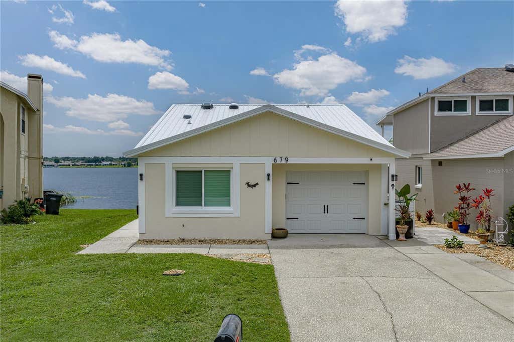 Photo of 679 Lake Dexter Circle, Winter Haven, FL 33884 (MLS # P4939365)