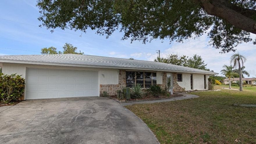 One or more photo(s) has been virtually staged. Welcome Home to this Charming, Well Maintained 2 Bed, 2 Bath Home Situated on an Oversized Corner Lot with a Park View. Outdoor Enthusiasts will enjoy the close proximity to the Public Boat Ramp, less than 1mile, giving you quick access to the Charlotte Harbor and the Gulf. Step inside this home to a Bright, Open Living Area that flows seamlessly into the Dining Room with Slider to Extra Large Patio that has a Privacy Fence and is perfect for relaxing and entertaining. Patio has electrical that could be used for a Hot Tub. Inside the Kitchen offers pass thru window to Patio, Ample Counter Space, Recessed Lighting, Pantry and Breakfast Bar. Primary Bedroom has its own Ensuite Bathroom and Walk In Closet. Second Bedroom is perfect for guests or an Office. There is also a Hall/Guest Bath with Large Walk In Shower. Major Upgrades that bring Peace of Mind include Newer Roof, New AC, New Flooring in Bedrooms and New Hot Water Heater. The Oversized 2 Car Garage has Storage Shelves, Attic Space and Side Door. Home is Conveniently located to Shopping, Dining, Medical Facilities, Parks, Beaches, Sports Stadium, Golfing and More! No HOA.