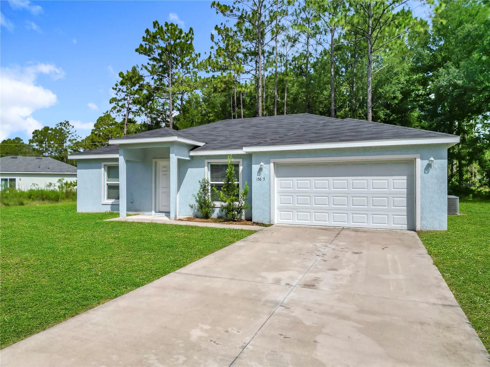 Welcome Home- This 3-bedroom, 2-bath home is in the heart of Marion Oaks—built by CKF Construction with quality and comfort in mind. From the moment you pull up, you'll notice the inviting curb appeal with a covered front porch and clean landscaping.
Inside, the open floor plan connects the kitchen, dining, and living areas —great for hosting or just everyday living. The kitchen features a center island and plenty of space to move around. The primary suite offers privacy, a large walk-in closet, and a spacious en-suite bath—your own little retreat at the end of the day.
Step outside your door and enjoy everything the Marion Oaks community has to offer—pickleball, basketball, volleyball, tennis, a splash pad, and even a gym membership for just $35 a year. The community center has meeting rooms, a library, and events for all ages.
With shopping like Aldi and Dollar General just minutes away—and a Marion County Sheriff’s Office right in the neighborhood—you’ve got convenience, connection, and peace of mind all in one place