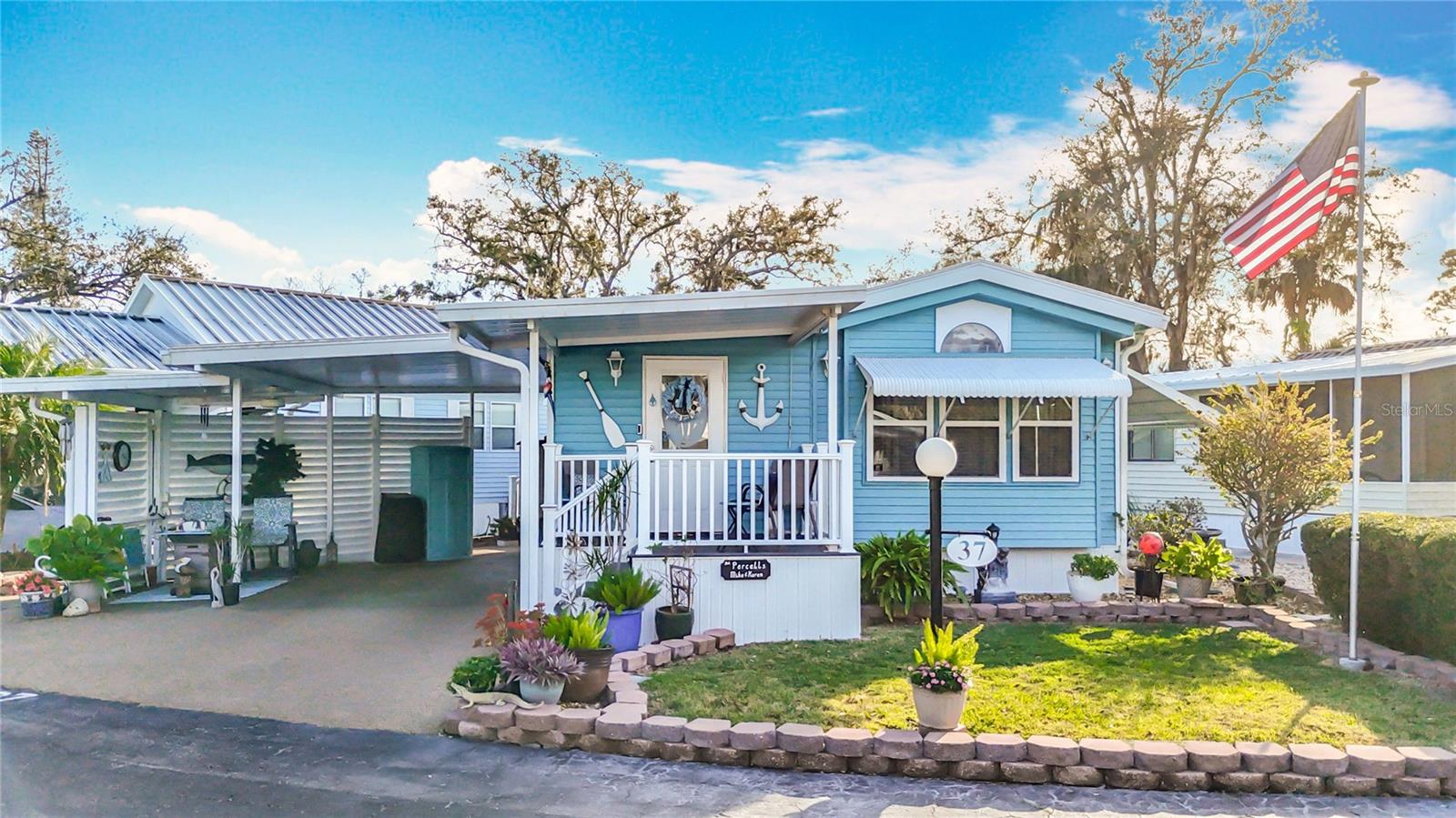 PRIDE OF OWNERSHIP IS EVIDENT IN THIS WELL-KEPT MOBILE HOME IN AN ACTIVE 55+ COMMUNITY! Move-in ready one bedroom, 1 1/2 bath home in Sugar Creek Resort. This home features multiple outdoor seating areas, carport, covered golf cart parking, inside laundry, tankless water heater, and updated kitchen. There is a bonus room which offers sleeping options for guests and has an en suite half bath. Spacious dining area. Updated shower and bathroom vanities. Rear patio overlooks green space and has a tennis court view. The covered front porch sees Glen Creek and the park boat launch. Double-pane tilt-in windows (2024), membrane roof (2021), central A/C (2022). All appliances, a 55" television, and three cabinet sheds are included. SUGAR CREEK RESORT has low HOA fees of just $442 each quarter and include water, sewer, trash, and grass mowing. Park amenities include heated pool, club house, tennis & shuffleboard, workshop, and many social activities during the winter season. Enjoy this home's proximity to the Braden River and River Links Golf Course. Sold for CASH ONLY. Sorry this is not a dog lot.