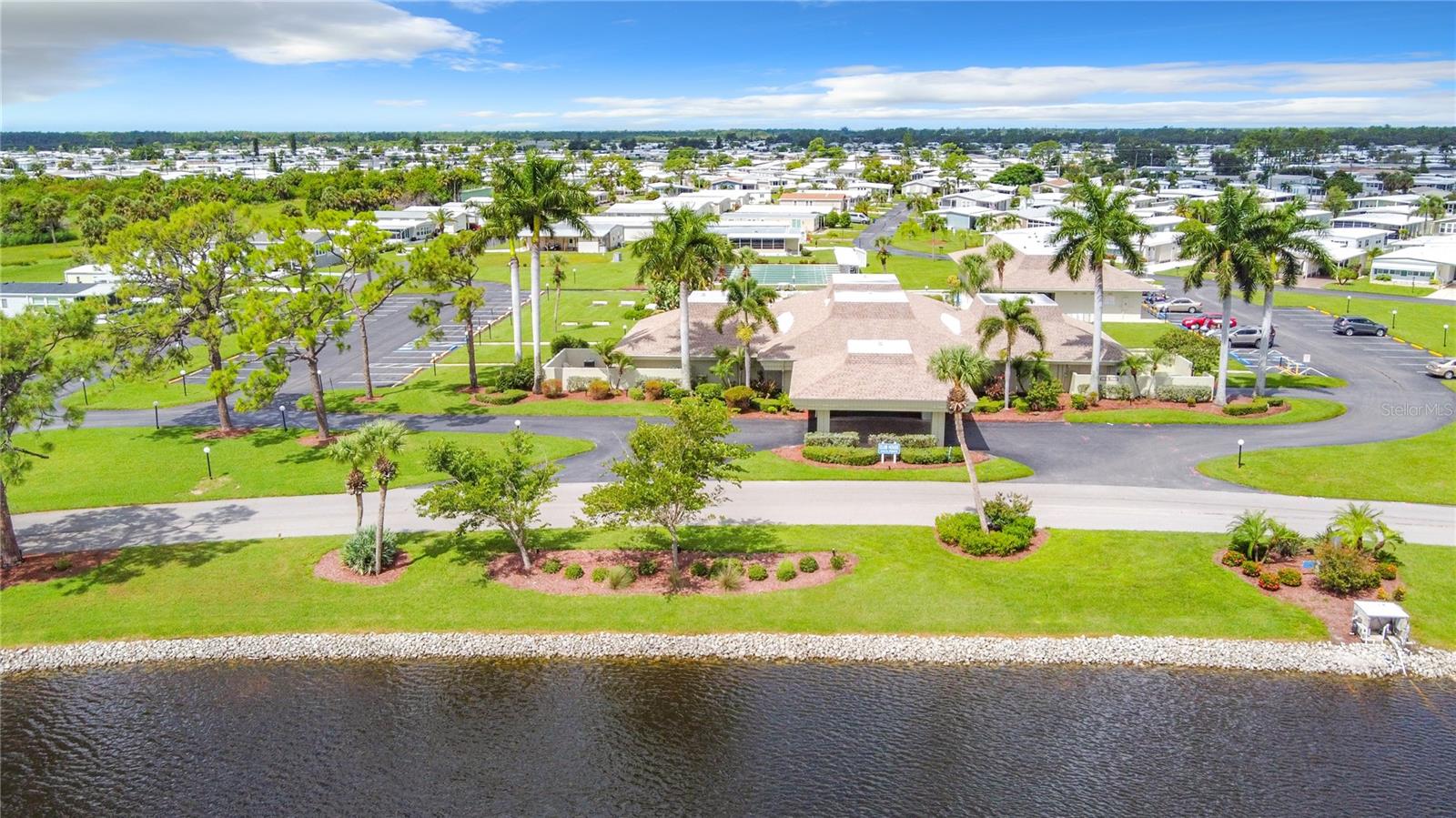 Discover the perfect spot to place your manufactured home in the highly sought-after LA casa Mobile Home Park! This oversized lot is ideally positioned near the exit, offering convenient access to the community's fantastic amenities. You'll be just a short stroll away from the clubhouse, pools, and a nearby grocery store, making everyday living a breeze. What sets this lot apart is the added privacy, with the median separating you from your neighbors across the street. The lot accommodates a spacious home with a larger driveway, a lanai. La Casa is a vibrant 55 - plus , Gated community featuring picturesque lakes, 2 heated pools, 2 Clubhouses, tennis courts, bocce ball, and 24|7 manned security at the gate. With a low HOA fee of just $191 A month. You will enjoy an active lifestyle in Sarasota premier North Port area. Embrace the opportunity to Make La Casa your new home today. Can be financed with a new Mobile home and package land deal..