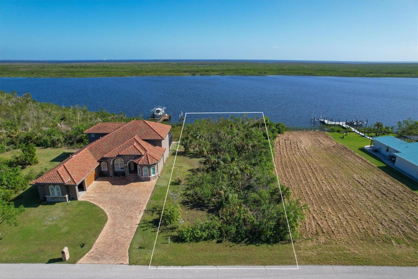 LOCATION LOCATION LOCATION**BEAUTIFUL SAILBOAT LOT**EXCEPTIONAL SUNRISES**NO BRIDGES**and EXPANSIVE WATER VIEWS of the INTERCEPTOR LAGOON (WHICH IS NOT IN A WAKE ZONE). This Exceptional Lot is Located in the WATERFRONT BOATING community of Sec 94 WATERVIEW PRESERVE adjacent to SOUTH GULF COVE !!! A BOATERS DREAM !!! With Direct Boating Access to the GULF of MEXICO, Surrounding ISLANDS and Beautiful Sandy BEACHES. This LOT has all utilities in place and is ready for your NEW "FLORIDA DREAM HOME". Enjoy All the Boats going by, Unbelievable SUNRISES and PANORAMIC WATER VIEWS. A lot of Beautiful NEW homes being built in the Neighborhood. Sec 94 of WATERVIEW PRESERVE is only Minutes away to Beautiful SOUTHWEST FLORIDA BEACHES in BOCA GRANDE and MANASOTA KEY. Adjoining Community offers a Boat Ramp, Marinas, Nice Parks and Playgrounds. Join our Yacht Club!!! Conveniently Located With Great Restaurants, Shopping, WORLD CLASS FISHING, Several great GOLF COURSES and so much more all within minutes away..A Great INVESTMENT opportunity!!! Build now or later!!! We work with several QUALITY AREA BUILDERS in all price points and have many Floor plans available. SO BRING YOUR SAILBOAT and Own a piece of PARADISE!!! Come EXPERIENCE the FLORIDA LIFESTYLE !!!