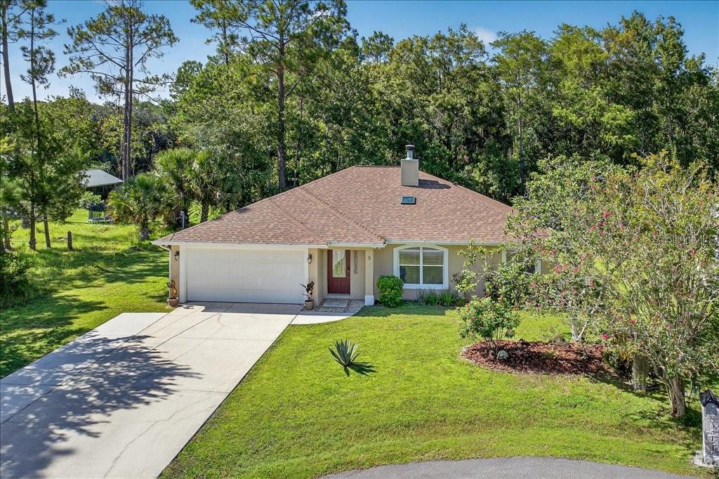 New roof, water heater and exterior paint. Located in the desirable Quail Hollow community in Palm Coast, Florida, this 3-bedroom, 2-bathroom home offers both comfort and convenience. Nestled in a peaceful cul-de-sac. The property provides easy access to US 1 and Town Center. Boasting 1,662 square feet of living space, this home features elegant tile and wood laminate flooring throughout. The spacious, open-concept kitchen comes equipped with stainless steel appliances and flows seamlessly into the inviting family room. Step outside to enjoy the meticulously maintained backyard, which includes a screened-in porch with tile flooring, perfect for relaxing or entertaining. The property backs onto a serene preserve, ensuring privacy and tranquility. Additionally, the oversized second bedroom is carpeted, includes a rear entrance, and can easily serve as a comfortable in-law suite. This home offers an excellent blend of style, space, and location. Don’t miss the opportunity to make it yours!