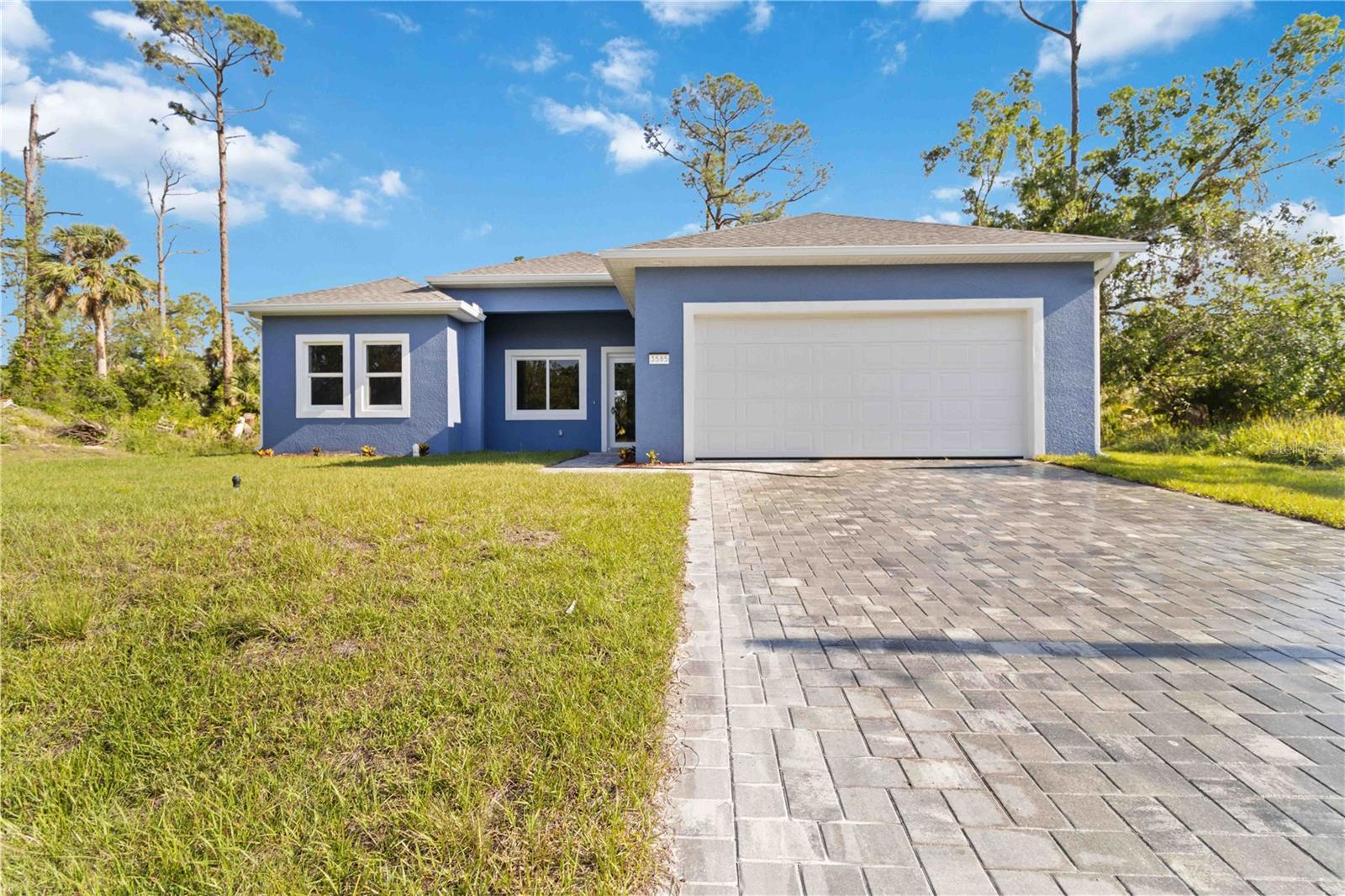 Introducing your ideal North Port, Florida home—brand-new construction offering the perfect mix of style, comfort, and convenience. This thoughtfully designed property features 3 spacious bedrooms, 3 well-appointed bathrooms, and a dedicated office, all set on nearly a quarter-acre lot. Step inside to find elegant touches throughout, including Luxury Vinyl Plank flooring, recessed lighting, and abundant natural light from generously placed windows. The open-concept layout flows into a sleek modern kitchen complete with Port White Quartz countertops, soft-close shaker cabinets, and premium fixtures—ideal for both everyday living and hosting guests.
This home is designed for easy living, with well and septic systems to help keep monthly costs manageable, and a peaceful setting that offers room for outdoor activities, gardening, or even adding a future pool. For added value, qualified buyers can receive up to $7,500 in closing cost assistance with the use of an approved lender, and the builder includes a 2/10 Home Warranty for extra peace of mind. Located in a rapidly growing part of North Port, you’ll enjoy proximity to parks, shopping, dining, and schools, all while enjoying the privacy of a quiet residential neighborhood. Move-in ready, this home offers a balance of modern design and classic Florida charm—waiting for you to make it yours.