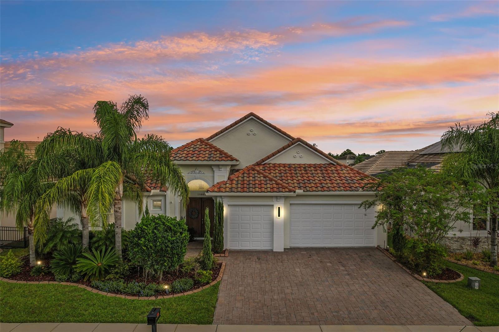 Welcome to 2580 Lancaster Ridge Drive, an exceptional ABD-built courtyard residence that exudes luxury living. This one-of-a-kind single-story home with a three-car garage and an attic elevator offers a perfect balance of elegance, functionality, and resort-style comfort.
Step inside to discover an open-concept floor plan, bathed in natural light from oversized windows and sliding glass doors. The central courtyard is the heart of the home, showcasing a sparkling heated pool and spa, enhanced with LED lighting, fountains, and a screened enclosure for year-round enjoyment. The entire home is designed for both relaxation and entertaining. The courtyard oasis features a top-of-the-line summer kitchen, and the back patio includes a remote-control retractable lanai screen, offering serene water and nature views that provide the ultimate in privacy.
Inside, every detail reflects sophisticated upgrades and timeless design. Highlights include a marble tile fireplace, plantation shutters throughout the home, custom closets, and a spa-inspired primary suite with a stand-alone soaking tub. The gourmet kitchen boasts high-end appliances and high-end finishes. Formal living and dining rooms create refined spaces for entertaining, while a private annex provides flexible living quarters ideal for guests, multigenerational needs or a private gym.
Unique features of this home include floorings and spray foam insulation in the attic, which creates ideal extra storage easily accessible by an attic versa-lift elevator! The fireplace, spa, and Paradise Grill outdoor kitchen are fueled by propane gas. Additional enhancements include solar heating for the pool, a whole-home water purification system, and a dark aluminum fence across the back yard. Select outdoor furnishings are also negotiable.
Set within Providence, one of Central Florida’s premier guard-gated golf communities, residents enjoy world-class amenities, lush surroundings, and the added peace of mind in a 24-hour guard-gated community.
This home is ready to deliver the Florida lifestyle you’ve been dreaming of. Schedule your private tour today and experience why 2580 Lancaster Ridge Drive stands above the rest.