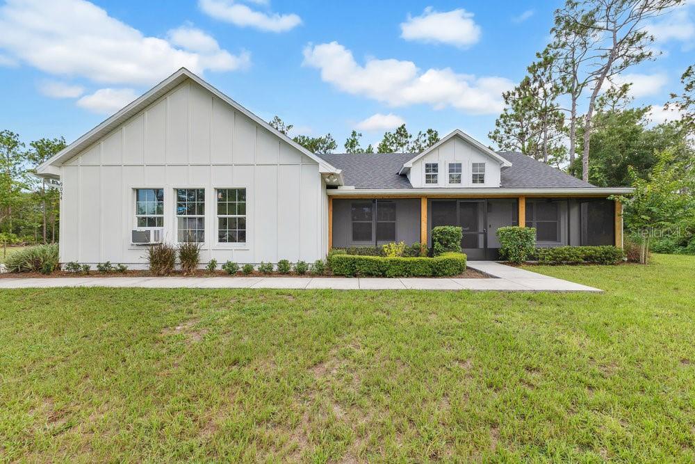 ** FARM HOUSE ALERT**Welcome to 9054 Lincoln Rd. St. Cloud Fl. Country living at it's finest! This gorgeous CUSTOM BUILT 2022 home sits on almost 1 FENCED IN acre. With BRAND NEW WORKSHOP, SCREENED FRONT PORCH AND EXTENDED LARGE SCREENED IN LANAI in back yard, TOP OF THE LINE NEW WATER PURIFYING SYSTEM AND MATCHING CUSTOM BUILT CHICKEN COOP. This home is a MUST SEE! Upon approching the home you will notice the ceadar wrapped colloms, the great double door entry. LUXURY VINYL FLOORS TRHOUGH OUT THE HOUSE! Relax in front of the FIRE PLACE featuring a hand crafted Cypress mantle or enjoy making Family diners in the OVERSIZED kitchen. Kitchen featuring Island with quarts counter tops, custom made hood vent, farm house sink, soft closed solid wood doors and drawers. MASTER SUITE is STUNNING, 2 WALK IN CLOSETS WITH hard wood shelving, SLIDING BARN DOORS, GARDEN TUB, WALK IN-SHOWER, HIS AND HERS VANITIES WITH QUARTZ COUNTER TOPS. NO HOME OWNER ASSOCIATION! ALL FURNITURE COULD BE NEGOTIABLE.centrally located and top rated schools .MOTIVATED SELLERS! Schedule your showing today!
<div style="padding:56.25% 0 0 0;position:relative;"><iframe src="https://my.matterport.com/show/?m=eAaFGLQffEF&mls=1" frameborder="0" allow="autoplay; fullscreen" allowfullscreen style="position:absolute;top:0;left:0;width:100%;height:100%;"></iframe></div>