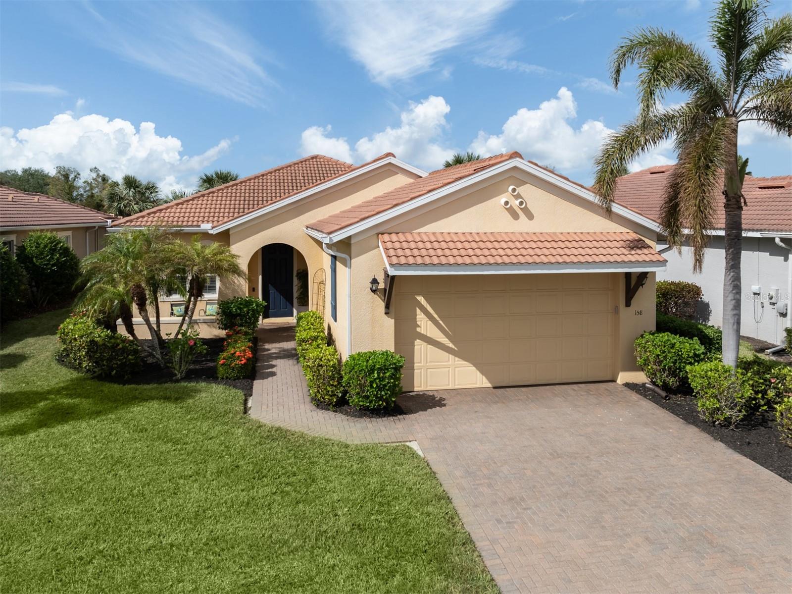 The Venetian Golf & River Club is a highly sought after gated community with a 24-hour GUARD. It offers the ultimate lifestyle with pickleball, tennis, a resort-style pool, lap pool, workout room, group fitness classes, an on-site restaurant, tiki bar, and a picturesque boardwalk along the Myakka River. This beautiful 3-bedroom, 2-bathroom home offers serene views of the golf course and lake, viewed best from the extended screened-in lanai, ideal for relaxing or entertaining, and metal hurricane shutters for peace of mind. Step inside to an expansive great room that opens seamlessly to the lanai with large sliders, creating an airy flow. Elegant custom tray ceilings with crown molding elevate the ambiance, while the kitchen boasts granite counters and stainless steel appliances. The primary suite is a retreat with dual closets, including a spacious walk-in. The River Club offers exceptional amenities: Dining, a 70-acre nature park along the Myakka River, a full fitness center and aerobic studio, a lap pool, a resort-style pool, and a tiki bar for the perfect blend of luxury and leisure. You are NOT REQUIRED to join the 18-Hole Championship Golf Club to live in the Venetian Golf & River Club, however, memberships to the Venetian Golf Club are available.