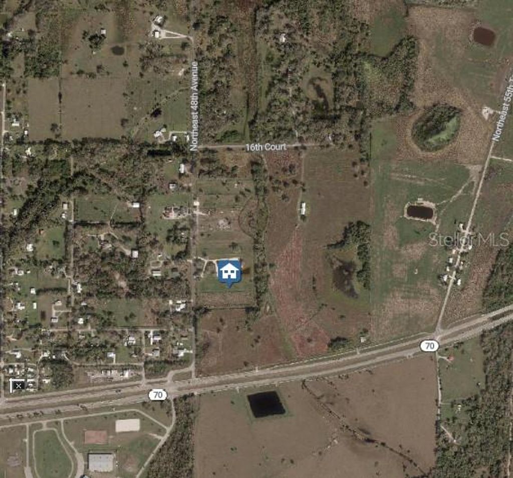 Photo of 1132 NE 48th Avenue, Okeechobee, FL 34972 (MLS # O6368869)