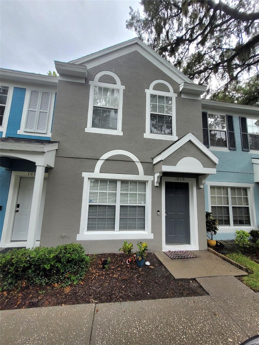 This well maintained two bedroom, two-and-a-half-bath townhome is located in the quiet, gated, Chase Townhomes community. Nestled among 100-plus year old Florida live oak trees in a park-like setting, this hidden gem offers incredible views, with the complex bordering Lake Bel-Aire – perfect for kayaking or paddle boarding. The townhome has laminate flooring, tile in the kitchen and baths, carpeting in the bedrooms. The generously sized living room and dining room open to the kitchen, making it ideal for family and entertaining. There is a half bath downstairs for convenience. New water heater and dishwasher recently installed. Enjoy nature out back, on your screened lanai with private storage. On the second floor, there are two large en-suite bedrooms with full baths, high ceilings, large windows, lots of storage and closet space. The washer and dryer hook-ups are upstairs, where they should be ;). The low monthly HOA dues include high speed interent, lawn care, exterior maintenance of the buildings (repainted 2022) and newer roofs (completed in 2021), along with Basic Internet and Cable. This perfect location is just minutes from the Sun rail Station, Downtown Lake Mary with shopping, restaurants, pickleball courts, parks, a weekly farmers market, neighborhood grocery, easy access to major highways leading to downtown Orlando, historic Sanford, or sunny beaches. The home is effortless to show! Call the owner today to schedule your private showing of this wonderful townhome!
