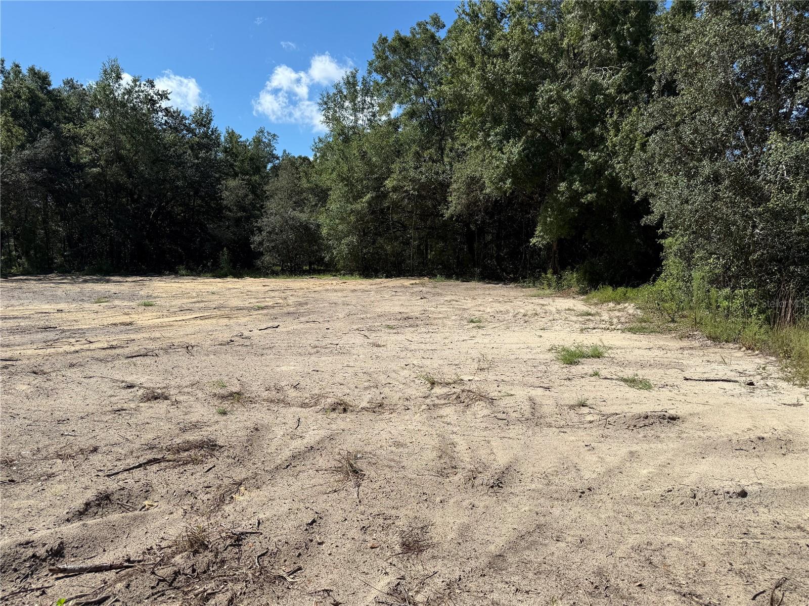 13498 SW 106th St, Dunnellon, FL 34432
Lot Size: 0.22 acres · Zoning: R1 · No HOA
Build-ready lot in Dunnellon with active building permit and approved plans included for the Florida model: 4 bedrooms, 2 bathrooms, 2-car garage, 1,571 sq.ft. under air and 2,147 sq.ft. total.
The property is cleared and level, with access to well and septic according to zoning (no municipal water bill) and a nearby power pole for quick connection. Located in a quiet residential area just minutes from the Dunnellon River and Rainbow Springs, with easy access to schools, shopping, and recreation.
Investor’s Advantage: Because the lot is already cleared and the building permit is approved, you save 3–4 months of work (land clearing, permitting) and can start construction today. This means you could have a finished home ready to generate income in record time.
High-Demand Floor Plan: The Florida model was designed to be spacious enough for large families, making it highly attractive in this area. For investors, this translates into higher rental potential and stronger returns compared to smaller homes.
Additional Opportunity for Investors: Adjacent lot is also available for purchase — it is cleared, has an active building permit, and approved plans.
Perfect for an investment property or your primary residence in a natural setting with no HOA restrictions.