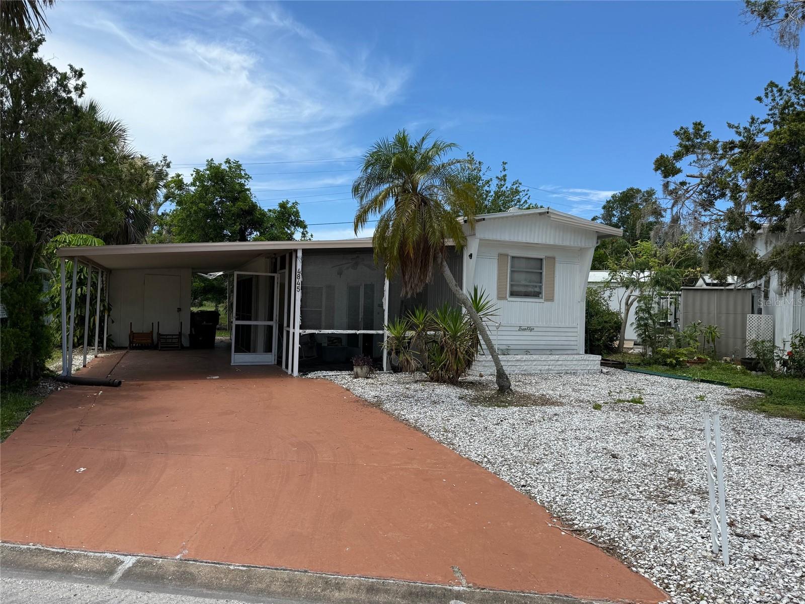 This Tri-Par Estates lot is almost ready for your new home. Buyer is responsible for removing trailer. This home has been flooded and mold is present. Selling for land value only. This site offers a great private location with no neighbors behind you and within walking distance to the many amenities available at this great community; a large pool, spa, tiki hut, pickleball courts, fitness center, shuffleboard, miniature golf, horseshoes, and clubhouse. RV and boat storage are available. Convenient to Sarasota’s downtown, world class beaches, UTC mall, and truly minutes from the airport. Low annual fees and land ownership are two big advantages to this community.