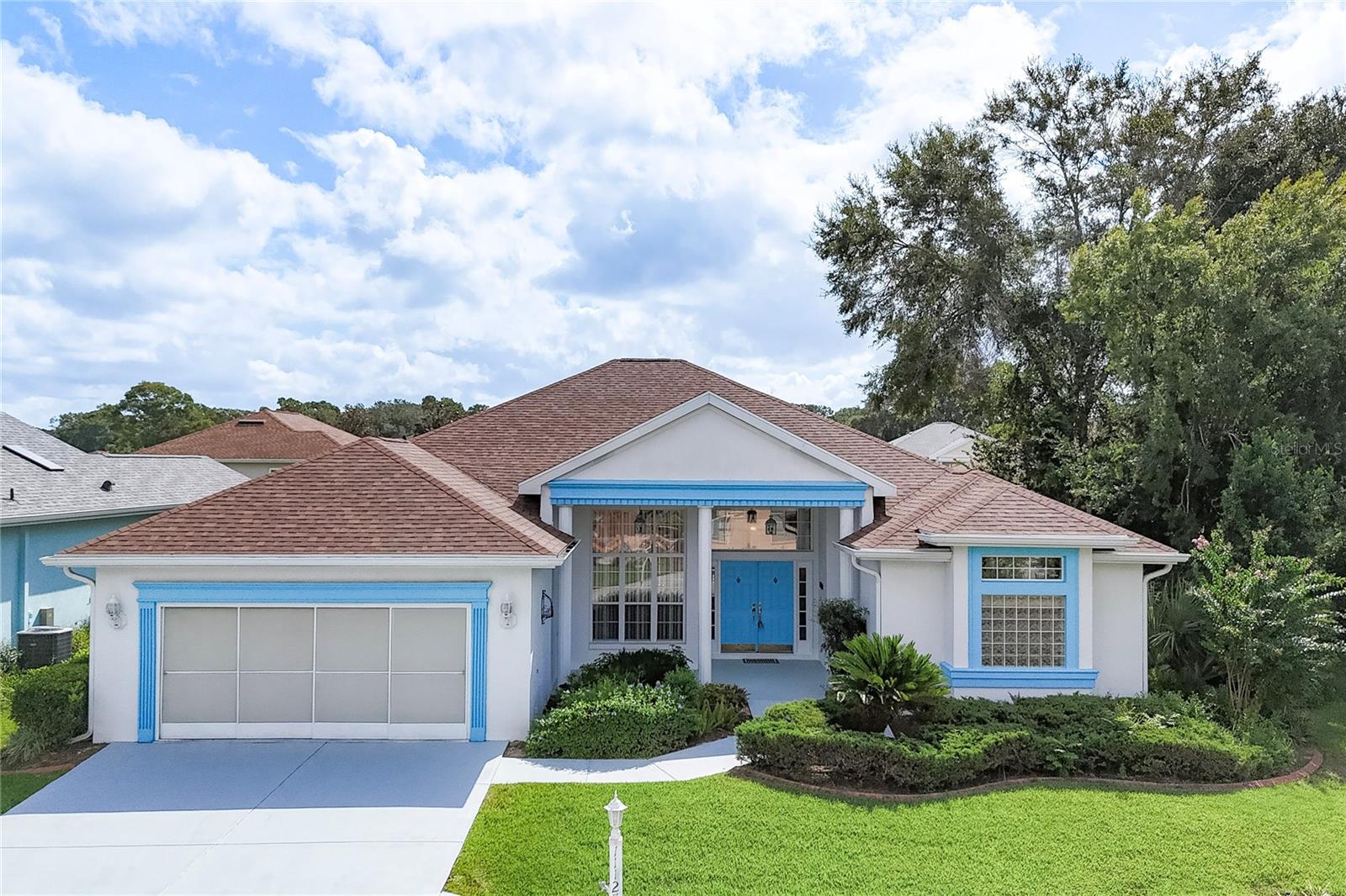 This 3/2/2 very popular Monaco Model Home is located in the Fountains Neighborhood, close to Palm Grove Pool, Fitness and Golf Course. Welcoming covered front porch leads to double French Doors. As you enter, you notice that it is perfect for entertaining your guests, with an open floor plan, High Ceilings, custom cove moldings and separate Formal Dining Room. The spacious Living Room with plenty of windows, creates a light and airy feeling! No lack of storage in this kitchen with custom built-in wall cabinets and pantry. The split floor plan works well with the Primary Bedroom separate from the other 2 guest bedrooms, on the other side of the home. Laundry room with utility tub, just off the kitchen. Large 2 car garage. New Roof & AC 2023. Oak Run is a 55+ gated community that has 6 pools, 5 spas, 2 fitness centers, 3 clubhouses, Library, Billiards Room, Crafts and Card Room, Dog Park, Restaurant, Golf Course and Driving Range. There are many clubs to join. Community is conveniently located close to Medical Facilities, Restaurants and Shopping.