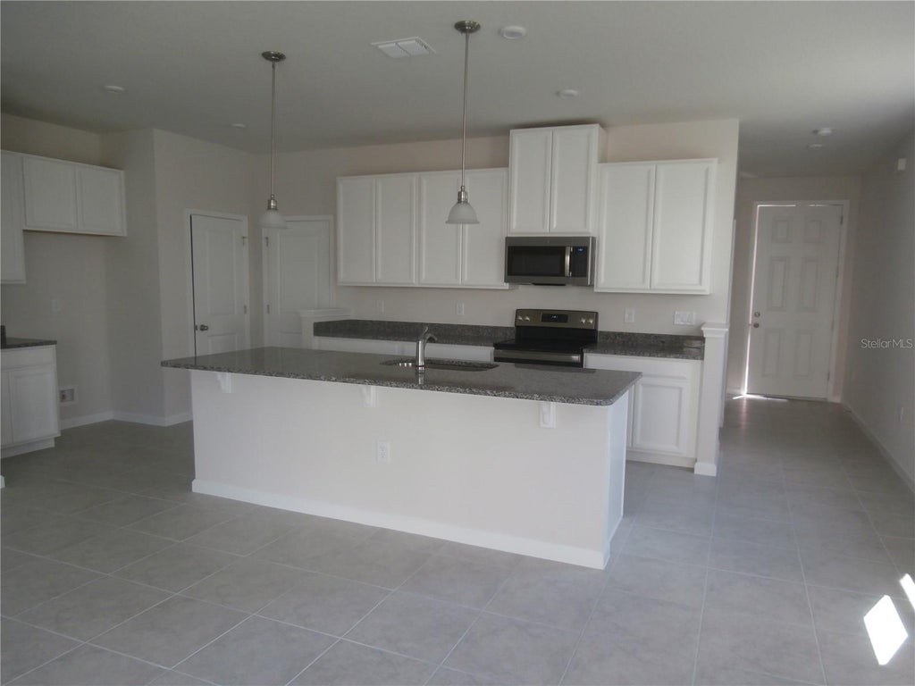 Photo of 2665 Pleasant Cypress Circle, Kissimmee, FL 34741 (MLS # O6441581)