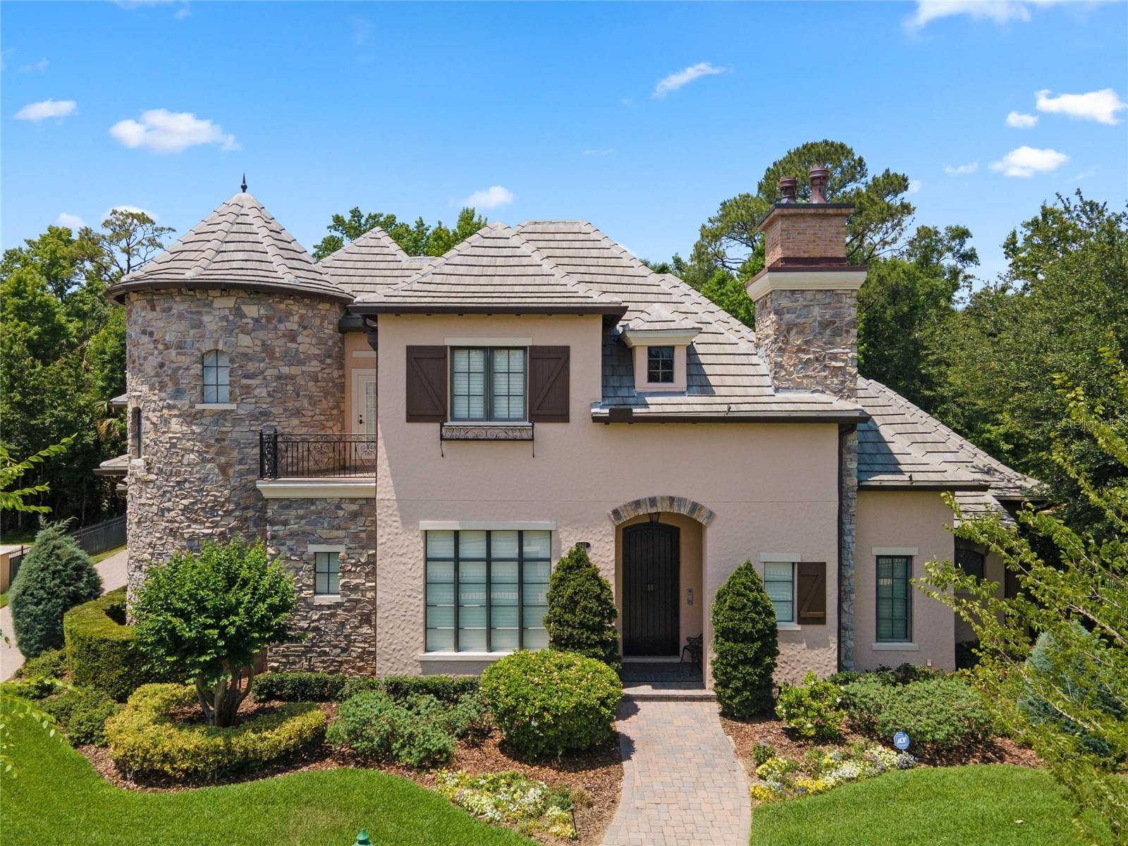 One or more photo(s) has been virtually staged. This once in a lifetime Castle Works home is Absolutely Amazing with all the beautiful upgrades and little secret extras. This home is so versatile from cozy nights in the theater watching your favorite movies/shows to entertaining. The incredible bar area along with the custom built outdoor kitchen and pool will amaze your guests. 3 of the 4 bedrooms in the main house are ensuites and one has a full bath right around the corner, along with 5 full baths and 1 half bath (main house) leaves you plenty of room for you the homeowner and friends. The garage apartment is fully contained and and gives you another bedroom and full bath. Tile roof is 3 yrs old with a warranty. Freshly repainted inside. Five air conditioners have all been replaced along with the hot water heater. Amazing theater has had new equipment and extra speakers put in as well. Kitchen is a gourmets happy place with upgraded appliances and a huge walk in pantry. Handy butlers pantry with sink and wine refrigerator adjacent to the formal dining area.
This amazing castle has natures beautify behind the house that will remain untouched. As you sit out in the screened patio you can enjoy the deer as they walk behind this home to their next adventure.