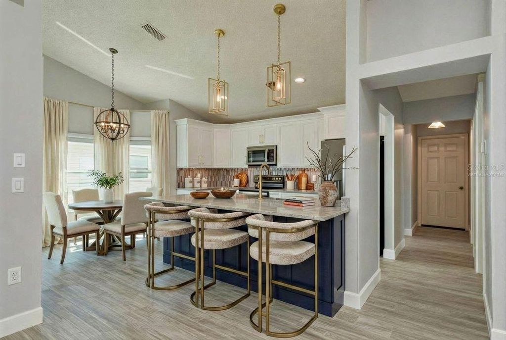 Photo of 161 Lake Shore Drive W, Palm Harbor, FL 34684 (MLS # TB8413048)