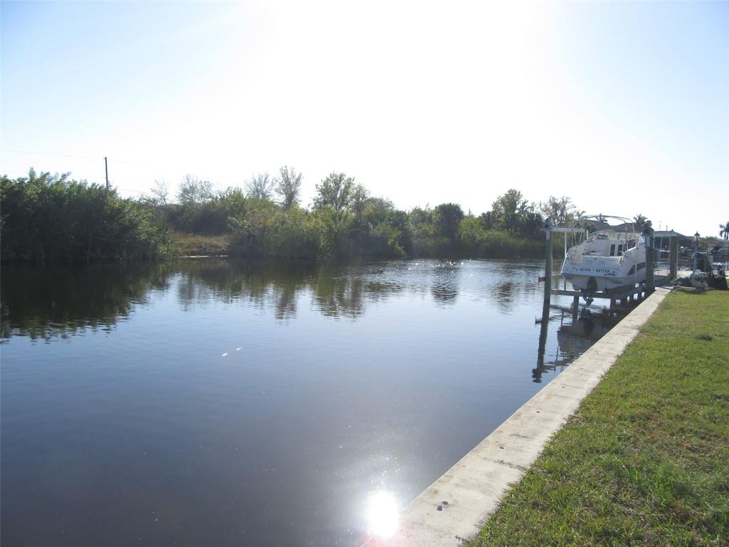Photo of 9572 Singer Circle, Port Charlotte, FL 33981 (MLS # C7488661)