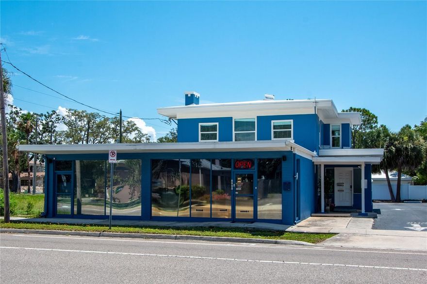 Rarely available, this unique mixed-use property offers the perfect blend of residential comfort and commercial opportunity in a prime Clearwater location. Situated at the highly visible location of Fort Harrison Avenue and Druid Road, this property features sought-after commercial and residential zoning, making it ideal for business owners, investors, or anyone seeking a versatile live-work setup. The spacious 3 to 4 bedroom, 2.5 bathroom pool home boasts refinished original hardwood floors (2025), two fireplaces, a sparkling pool with a recently rescreened enclosure (2025), and a flexible interior layout perfect for families or multi-generational living. Two separate, street-facing commercial office spaces with expansive glass frontage provide unbeatable visibility on busy Alternate US 19 (Fort Harrison), ensuring your business stands out. Modern upgrades include a new roof (2021), two brand new A/C systems (2025), a surveillance security camera system, and an electric vehicle charger. The property offers eight dedicated parking spaces and is located in a non-flood, non-evacuation zone for peace of mind. Enjoy being directly across from desirable Harbor Oaks and less than eight minutes to Clearwater Beach. With its high-traffic location, ample parking, and combination of retail and residential space, this property is a rare opportunity for anyone looking to maximize both lifestyle and investment potential in the heart of Clearwater!
