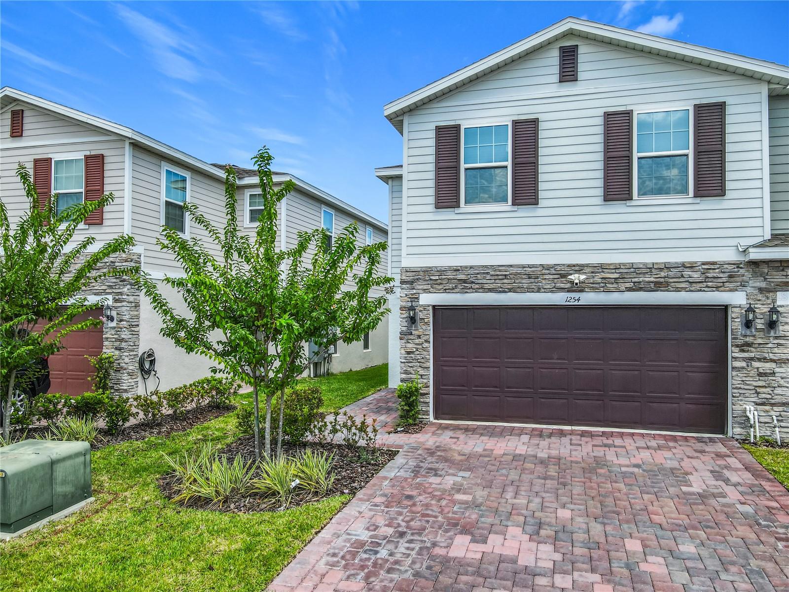 Exceptional property with superior finishings is located on a corner homesite and features an open-concept and meticulously designed layout, including 3 Bedrooms, 2.5 baths, and a 2-car garage with an upgraded garage door opener, insulated garage door, and a water softener. Superior finishings include tile flooring throughout the 1st floor main living areas, along with tinted windows, window treatments, and ceiling fans.
The spacious Great Room overlooks a rear covered Lanai ? perfect for entertaining and outdoor living. The beautifully appointed Kitchen includes 42" upper cabinets and perfectly matching quartz countertops with a coordinated backsplash, as well as stainless appliances and upgraded lighting. Upgraded bathroom fans are also featured. A Jack and Jill Bath suite with separate vanities is conveniently located between the secondary Bedrooms. The large Primary Bedroom includes an en-suite with dual sinks, a walk-in shower, and a linen closet. Cypress Hammock offers incredible amenities including a resort-style pool, splash pad, fenced playground, multi-sports field, picnic area, BBQ grills, and scenic walking trails, with no CDD fees. Conveniently located near shopping and dining, with easy access to major thoroughfares, this home is also less than 2 miles from the Sun Rail Station and a brand new K-8 school. Don't miss the chance to make this dream home yours.