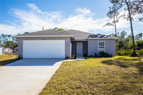 Photo of 18059 Regan Avenue, Port Charlotte, FL 33948 (MLS # O6231293)