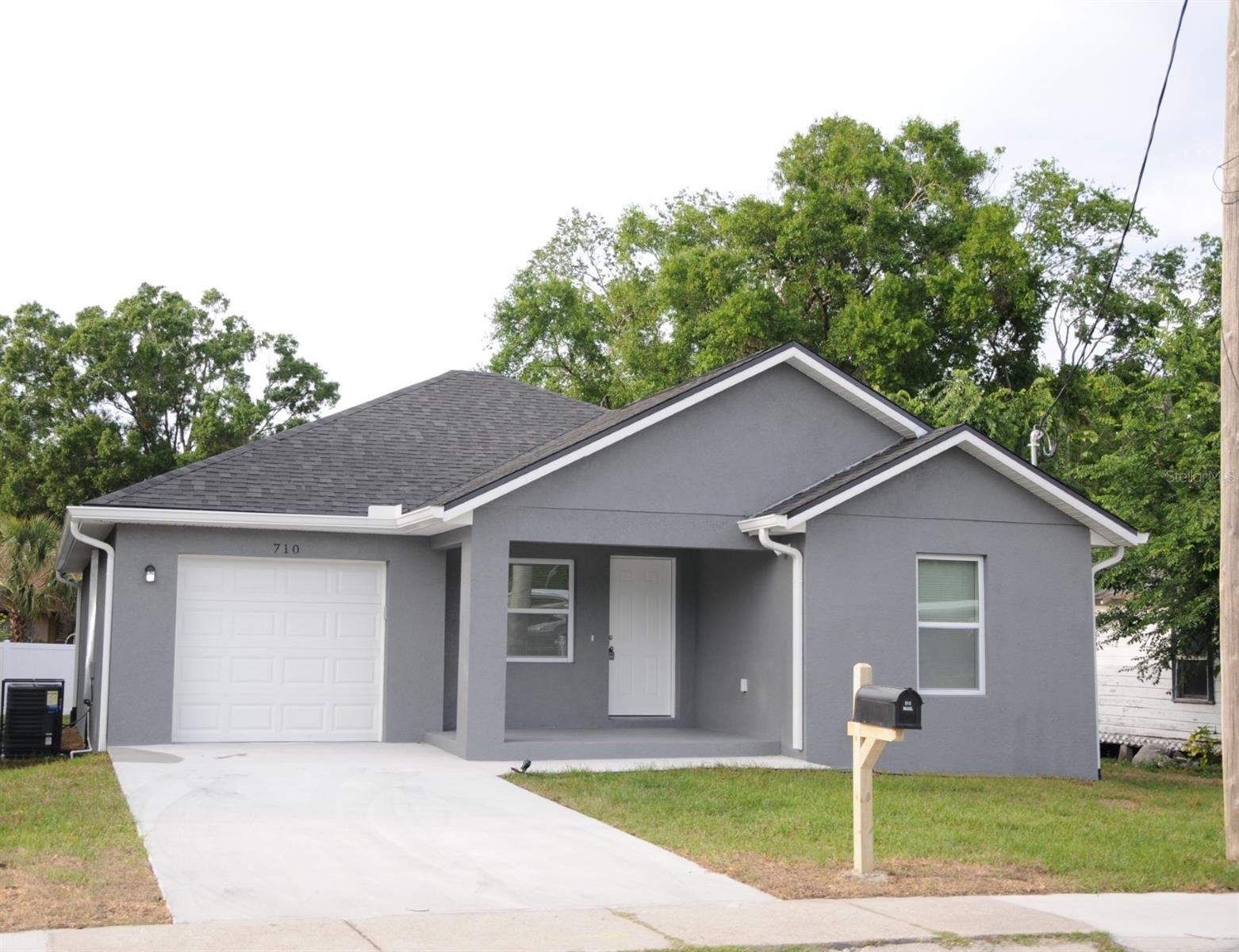 Charming, just completed new construction 3BR, 2BA concrete block home with 1 car garage close to downtown Plant City’s historic district and within walking distance to Samuel Cooper Park. You can be the first family to live in this brand new, beautifully finished home! Everything is new, including a full package of stainless steel and energy efficient appliances with microwave oven! Lots of natural light with oversize windows including designer blinds and features an open floor plan. Kitchen counter tops are solid granite and cabinetry throughout are made of real wood, including a breakfast “peninsula” bar – perfect for casual meals. Bedrooms all have oversize closets including a walk-in closet in the Master BR. Flooring throughout is ceramic and vinyl plank. Bathrooms walls are ceramic tiles and Master Shower is finished with frameless glass door. There is a lovely back porch to sit and enjoy your open backyard that is enclosed with new white vinyl fencing. Washer and dryer hookups are available and ready for your laundry equipment. LAWN MAINTENANCE AND PEST CONTROL IS INCLUDED!! Pet friendly, too!