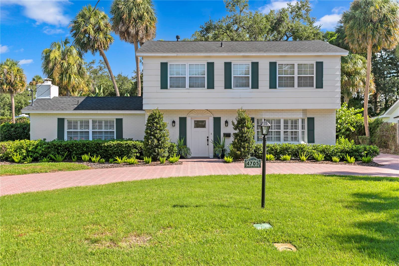 Welcome home to this gracious Colonial, in a prime South Tampa location, on over a quarter-acre homesite (82 X 137). Pull into the handsome brick paver circular driveway, and step into this immaculately maintained home. Well-loved by the same owner for over 40 years, this home features bright and cheerful rooms with every last detail attended to. COMPLETELY RENOVATED over the years! Beautiful WOOD FLOORS THROUGHOUT, NEW KITCHEN, UPDATED BATHS, 2-YEAR OLD ROOF, NEW HVAC, UPDATED WINDOWS, and more. The front foyer with traditional center-hall stair greets your guests, and is flanked by a lovely living room with plenty of space. Step into the formal dining room, and then be treated to a new all-white kitchen with gorgeous quartz countertops and new appliances. A large family room with wood burning fireplace and tons of natural light awaits evenings of laughter and holidays of joy. Step into the tremendous backyard, where you are greeted to a breezeway out to the HUGE GARAGE with room for two large vehicles, plus a workshop, storage, and more. Upstairs are three guest bedrooms, updated hall bath, and the primary suite. This home is pristine, ready for immediate occupancy, and is located in a top school district (Dale Mabry Elem, Coleman Middle, and Plant High). Call today!