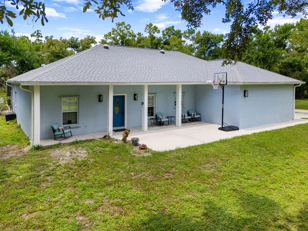 This awesome home on 3.1 fenced acres is waiting for YOU! As soon as you pass through the electric gate you truly will be thinking of all the possibilities. You will enjoy the cleared land for planting a flower or vegetable garden. This non-restricted deed area also allows for animals. No more egg shortages when you raise your own chickens. The animal preference is up to you. If you are into horses or ponies you totally have found a perfect location. There are several parks in the area perfect for walks and horse back riding. The edge of the Myakkahatchee Creek Environmental Park is only 1 mile from this location.
The Master Bedroom En suite comes complete with double bowl sinks and shower as well as a spacious closet. Bedroom two & three are on the opposite side of the house and share a Tub/Shower bathroom combo.
Having company? That is no problem. Attached to the main house is an in-law suite. This private large room has its own entry and exit door out onto the pool area. I overlooked the gorgeous tongue and groove ceilings and new vinyl wood look floors. Many extras such as a RV garage, chicken coop, and a 30 x 50 workshop. BUT WAIT there's more! Large two story open air barn which you can tailor to your animals needs.
You will love the privacy of the North Port Estates with the city amenities. Hope to see you soon!