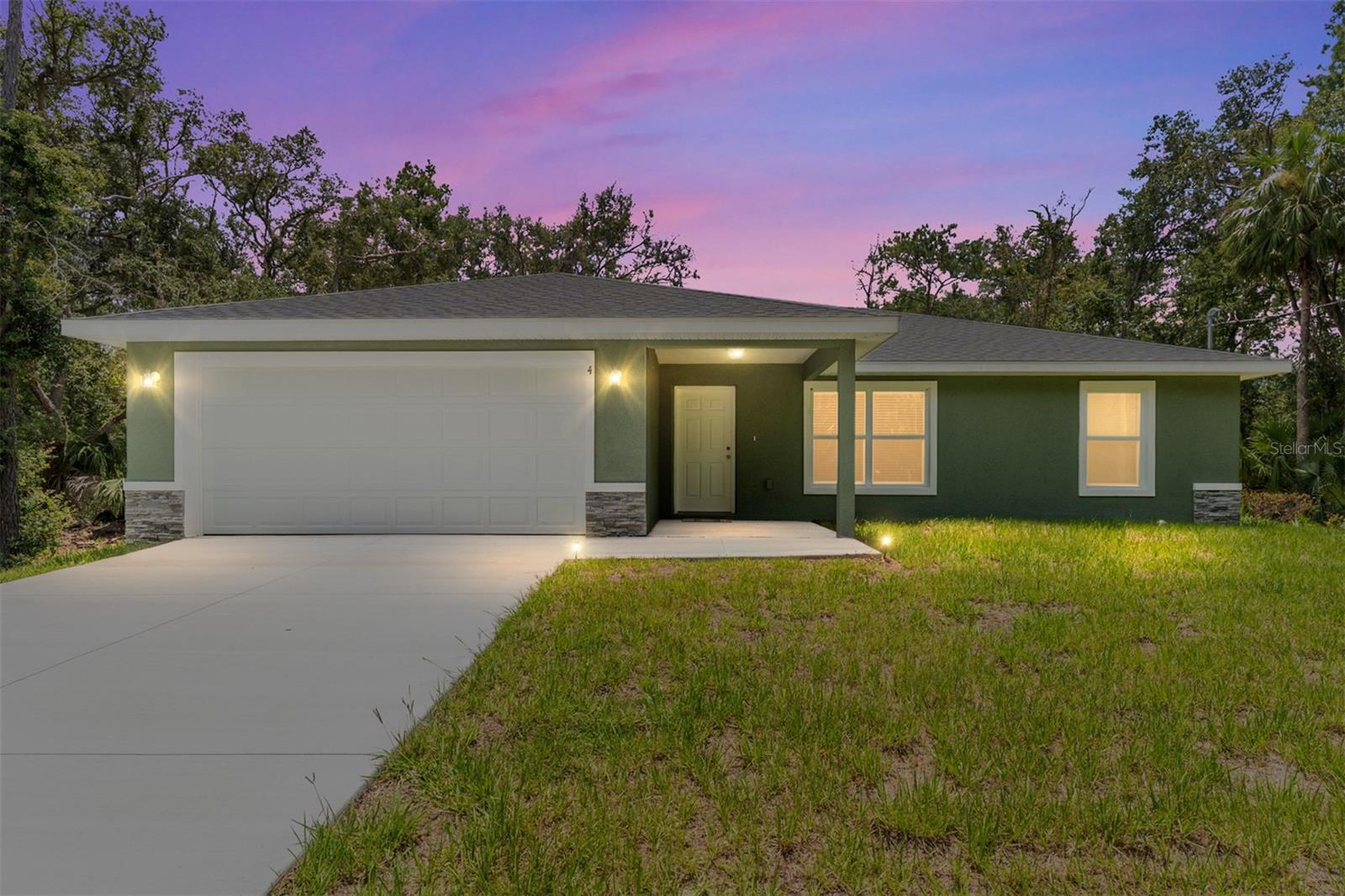 One or more photo(s) has been virtually staged. Beautiful and popular 3/2/2 in Ocklawaha! Come live in the country but have all the dining and shopping opportunities in nearby The Villages, Summerfield and Ocala. Enter into an open floor plan home with gorgeous Luxury Vinyl Plank flooring except in Bedrooms where nicer carpet and padding greets your feet. The kitchen & Bathrooms feature White Wood soft close Cabinets & Granite counters tops. Your new kitchen has a large pantry, recessed lighting, & Stainless-Steel Range, Dishwasher, Microwave & Refrigerator. Open the doors in dining area to a spacious backyard. The laundry room is inside and room for storage. You will love the many small ponds and lakes, the Ocklawaha River and quick drive to Lake Weir. The Primary bedroom is roomy enough for a King- Sized bed and walk in closet for your many clothes. The Primary bathroom has double sinks, along with wood soft close cabinets & a walk in shower. The laundry room is INSIDE with room for shelving and the 2-car garage has an automated garage opener. You will love the many small ponds and lakes, the Ocklawaha River and quick drive to Lake Weir. Have fun at nearby Gator Joe's and Eaton's Beach