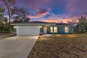 One or more photo(s) has been virtually staged. Beautiful and popular 3/2/2 in Ocklawaha! Come live in the country but have all the dining and shopping opportunities in nearby The Villages, Summerfield and Ocala. Enter into an open floor plan home with gorgeous Luxury Vinyl Plank flooring except in Bedrooms where nicer carpet and padding greets your feet. The kitchen & Bathrooms feature White Wood soft close Cabinets & Granite counters tops. Your new kitchen has a large pantry, recessed lighting, & Stainless-Steel Range, Dishwasher, Microwave & Refrigerator. Open the doors in dining area to a spacious backyard. The laundry room is inside and room for storage. You will love the many small ponds and lakes, the Ocklawaha River and quick drive to Lake Weir. The Primary bedroom is roomy enough for a King- Sized bed and walk in closet for your many clothes. The Primary bathroom has double sinks, along with wood soft close cabinets & a walk in shower. The laundry room is INSIDE with room for shelving and the 2-car garage has an automated garage opener. You will love the many small ponds and lakes, the Ocklawaha River and quick drive to Lake Weir. Have fun at nearby Gator Joe's and Eaton's Beach