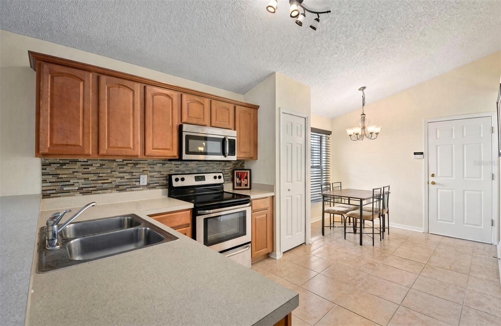 Photo of 4808 Northern Dancer Way, Orlando, FL 32826 (MLS # O6446973)