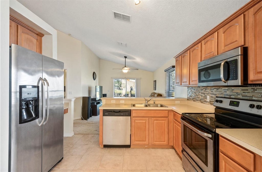 Photo of 4808 Northern Dancer Way, Orlando, FL 32826 (MLS # O6446973)