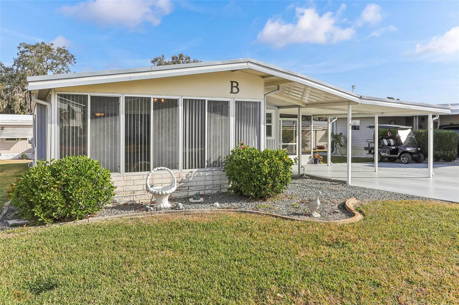 Welcome to this inviting 2-bedroom, 2-bath home in the highly sought-after 55+ community of Harbor Oaks. Situated along the shores of Lake Griffin, this home offers a fantastic opportunity to enjoy an active and relaxed lifestyle in a beautiful setting.
Step inside to find a spacious layout with plenty of natural light. The home features a bright and airy Florida room, perfect for relaxing or entertaining. The main portion of the house has been updated with new double-paned windows, enhancing energy efficiency and comfort. A double driveway with a durable epoxy coating provides ample parking, while the roof-over, just 4 years old, adds peace of mind.
Harbor Oaks offers incredible amenities, including a clubhouse, heated pool and spa, shuffleboard, horseshoes, Petanque, a fishing pier, and a 31-slip covered marina with a private boat ramp. Enjoy easy access to boating, fishing, and stunning sunset views. Plus, The Villages is just 15 minutes away, offering endless options for shopping, dining, entertainment, and medical services.
Don’t miss this chance to make Harbor Oaks your new home—schedule your tour today!