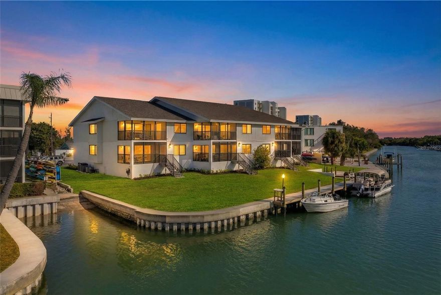 It’s time to SIMPLIFY!  Sun.  Sand.  Surf.  Welcome to this completely renovated residence at Castaway Cove, a boutique waterfront condominium community tucked away on the quiet south end of Siesta Key, just a short walk to Turtle Beach.  This second-floor unit offers a rare coastal vantage point with sweeping views of Blind Pass Lagoon, the Intracoastal Waterway, and the Gulf of Mexico, delivering a rarely found three-water perspective.  Morning light reflects across the lagoon, afternoons might feature manatees or dolphins, and evenings are reserved for unforgettable sunsets over the Gulf.  Dock space is available for boating enthusiasts, and the calm lagoon waters provide ideal conditions for kayaking and paddleboarding from Castaway’s private launch toward the newly-opened Midnight Pass.  
The residence has been remodeled wall to wall and floor to ceiling since 2020, with thoughtful attention to both design and infrastructure.  The open floor plan blends the kitchen, dining, and living areas seamlessly, allowing water views to take center stage from nearly every angle.  Porcelain tile flooring runs throughout the entire unit, creating a clean, cohesive look that complements the seaside setting.  The kitchen features shaker-style Providence White cabinetry with glass-front display cabinets and interior lighting, a pantry with pull-out shelving, Pompeii Quartz countertops, a Glazzio tile backsplash, and updated appliances including refrigerator, range, dishwasher, built-in microwave, washer, dryer, and HVAC system.  The primary suite, perched above Blind Pass, is a serene retreat with crown molding, solid core doors, and custom closet systems with mirrored panels.  The ensuite bath offers dual vanities topped with Pompeii Quartz, a walk-in shower with glass enclosure, tiled bench, multiple body jets, subway tile walls, and subtle motion-sensor lighting.  The guest suite, with views of the ICW, features a barn door entry and a bath with cast-iron tub and quartz-topped vanity.  A screened lanai extends the living space outdoors with porcelain tile flooring, a tongue-and-groove ceiling, new screens and railings, and tranquil water views that invite morning coffee or evening relaxation.  Additional features include recessed lighting throughout, ceiling fans, a woven dining area chandelier, sheer and room-darkening solar shades, Schlage door lock, Ring doorbell, and Nest thermostat.  Castaway Cove is a low-density community of just eight residences offering ample parking, professional management, and exceptionally low association fees.  Recent community improvements include a new seawall, refreshed landscaping, updated exterior lighting and irrigation system, and a freshly painted building.  The two-story structure is NOT subject to a Milestone Inspection.  Furnishings may be available for a truly turnkey opportunity.