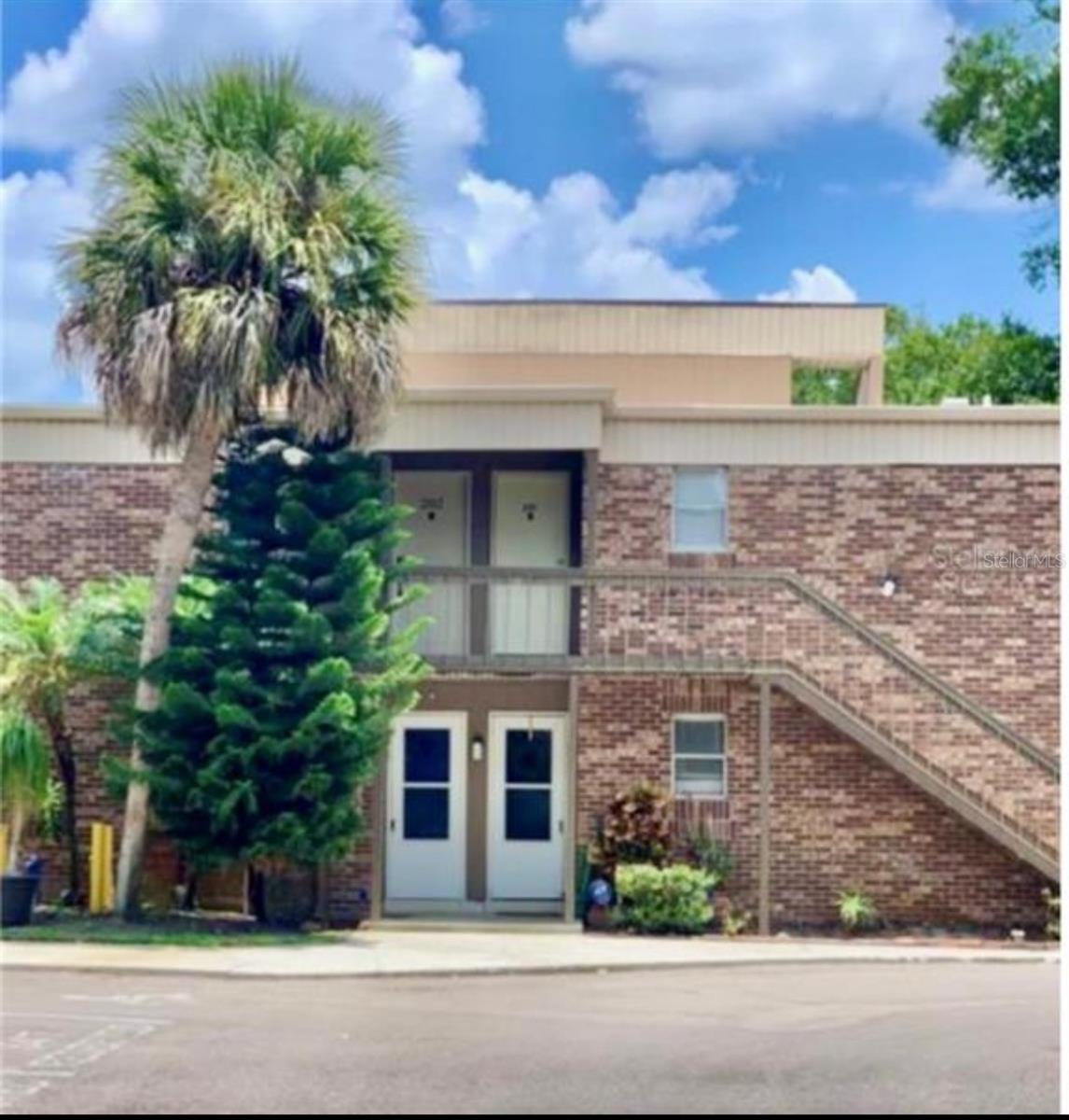 Available for Immediate Occupancy!!! Welcome to Carrollwood! This stylish and modern corner-unit one-bedroom condo is perfectly situated in the heart of Carrollwood. Step inside to an open and inviting living space highlighted by soaring vaulted ceilings and warm engineered hardwood floors throughout. The kitchen features stainless steel appliances, shaker cabinets, granite counters, and a breakfast bar that blends contemporary elegance with everyday functionality. The living room is designed for comfort and relaxation, with sliding doors that open to a private balcony overlooking a tranquil pond view. When it’s time to unwind, retreat to the cozy bedroom for restful nights. Located in a prime Carrollwood community, this condo offers easy access to shopping, dining, and entertainment.