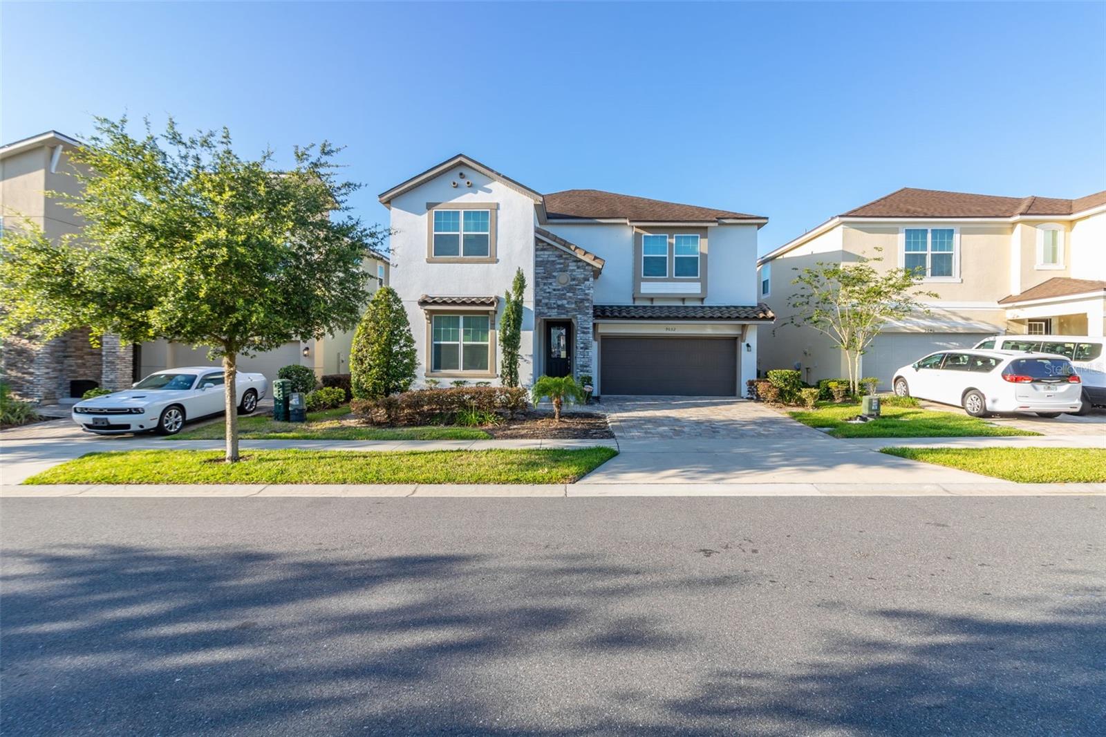 This stunning and beautifully decorated 6 bedroom home with a stunning blend of tasteful decorated design for the adults and amazing theme rooms. The Grand Living allows for comfortable lounging and opens into the Large Kitchen with Granite counters, 42 inch expresso cabinets, an island with seating for 5 along with a dining area with seating for 8. The home has lots of natural light from the windows and sliders from the living and dining area. The large paver covered lanai opens to a heated pool and spa with screen in enclosure for maximum enjoyment of the outdoors. From the pool is a separate entrance into a bath and leading to a wet bar to keep the party going. Downstairs is a Master Bedroom and Bath which has a stall shower, walk in closet and dual sinks and a Toy Story Themed room with 2 twin beds. Upstairs is a large loft area with seating, tv, pub table, sofas and pool table for additional space for enjoying your vacation. Also located on the second floor is another Master Bedroom with Master bath, a Minion Themed bedroom with 2 twin beds, a bedroom with queen bed with jack and jill bath with dual sinks and tub shower combination. The 6th bedroom is has a king bed and hallway bath with tub shower combination. The laundry is also located on the 2nd floor. The home offers all the comforts and space for maximum enjoyment and is located 1 block to the most amazing Grand Clubhouse with Water complex complete with Splash Pad, Wave Simulator, Ice Cream Shop, Sundries Store, Bar and Grill, tween/teen hangout area for making friends and Fitness Center. The community also has basketball courts, tennis and soccer fields. Located 8 miles from Disney and a short drive to Universal and Sea World. Conveniently located to shopping, restaurants and outlet stores, this home is in a prime location. HOA includes basic cable, internet, trash, grounds maintenance and 24 hour guard gate. Bookings and management are in place.