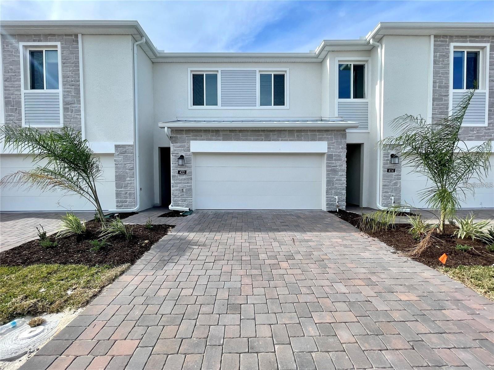 Gorgeous home situated in Champions Pointe, a master planned community in the city of Champions Gate. The Azalea floor plan features 3 bedrooms, 2.5 bathrooms, a 2 car garage, and a spacious open concept combination of living room and dining room. The kitchen is fully equipped with stainless steel appliances, quartz countertops, and an eating space. Homeowners will have access to a community tot lot and swimming pool with cabanas, as well as the Oasis Clubhouse, where they can enjoy resort style amenities including a lazy river, water park, cinema, restaurants, and activities for the whole family.
For family friendly living, students will be served by Four Corners Upper School, a highly ranked Charter School. With close proximity to I-4, FL-429, and US-27. Champions Pointe is just a 20 minute drive from Disney World and convenient to other world class attractions, shopping centers, restaurants, entertainment venues, and much more.